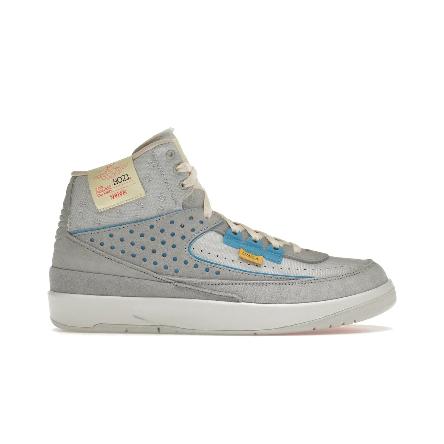 Jordan 2 Retro SP Union Grey Fog - Image 1 - Only at www.BallersClubKickz.com - Introducing the Air Jordan 2 Retro SP Union Grey Fog. This intricate sneaker design features a grey canvas upper with light blue eyelets, eyestay patches, and piping, plus custom external tags. Dropping in April 2022, this exclusive release offers a worn-in look and feel.