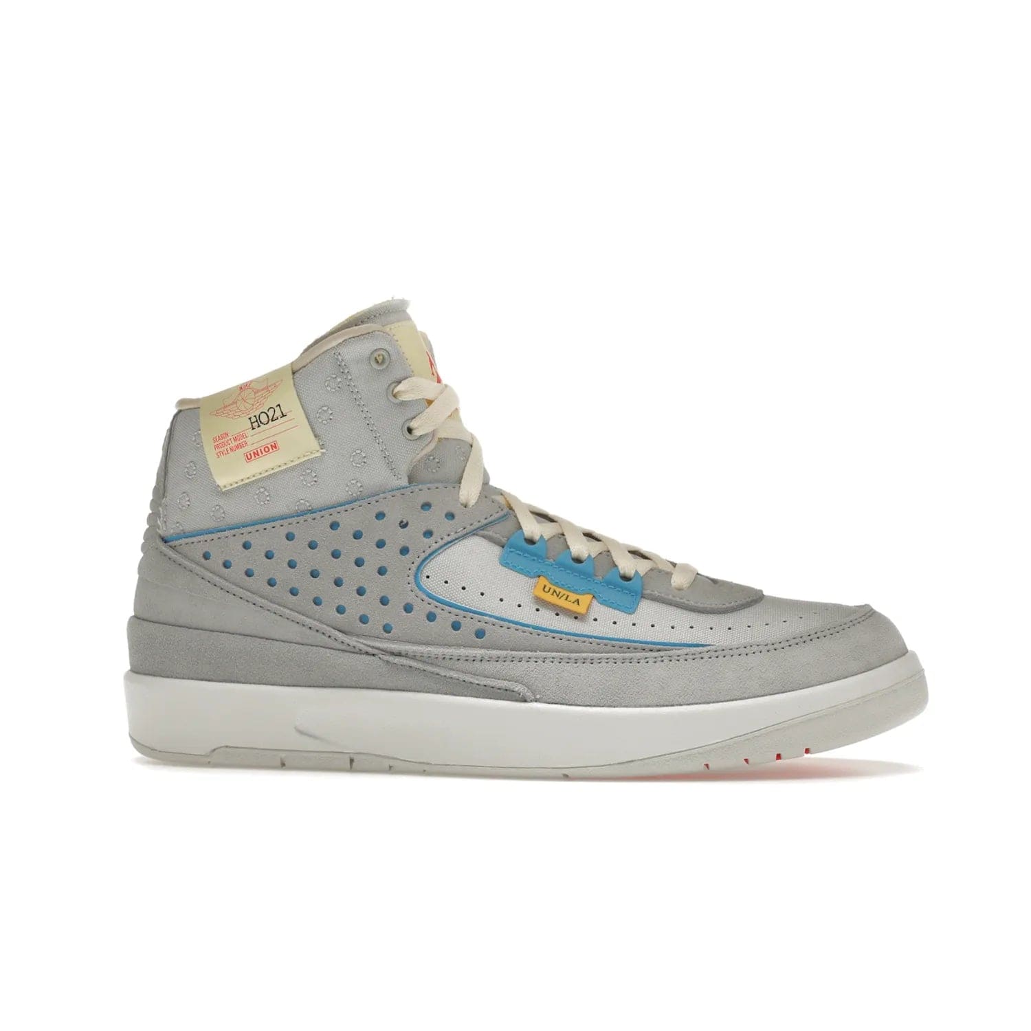 Jordan 2 Retro SP Union Grey Fog - Image 2 - Only at www.BallersClubKickz.com - Introducing the Air Jordan 2 Retro SP Union Grey Fog. This intricate sneaker design features a grey canvas upper with light blue eyelets, eyestay patches, and piping, plus custom external tags. Dropping in April 2022, this exclusive release offers a worn-in look and feel.