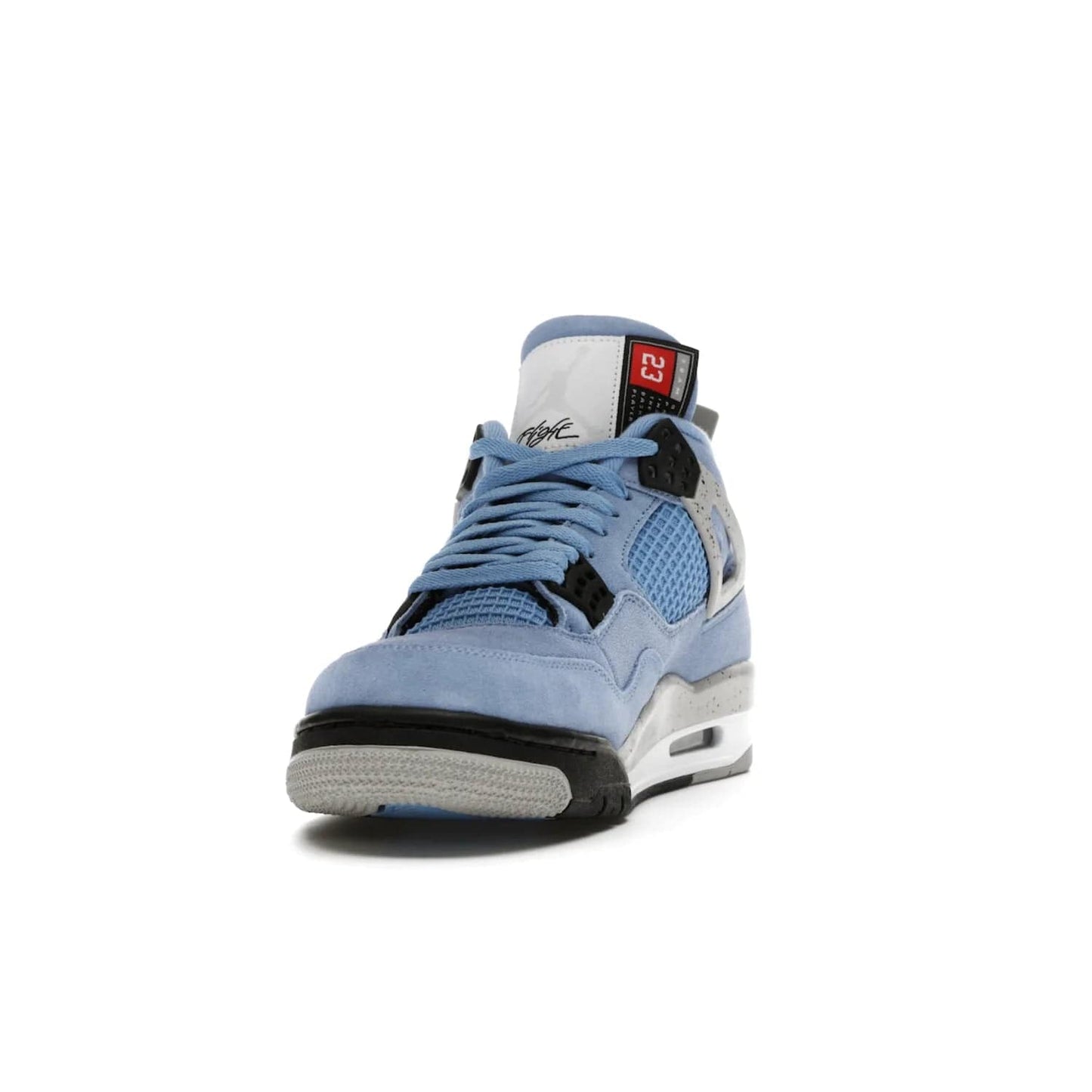 Jordan 4 Retro University Blue - Image 12 - Only at www.BallersClubKickz.com - The Air Jordan 4 University Blue honors MJ's alma mater. Rich University Blue suede, panels of netting, and Cement Grey speckled eyelets give this design an edgy look. Features a black, white and Tech Grey sole with a clear Air unit and two woven labels on the tongue. Jumpman logo & Team Jordan jock tag included. Released April 2021.