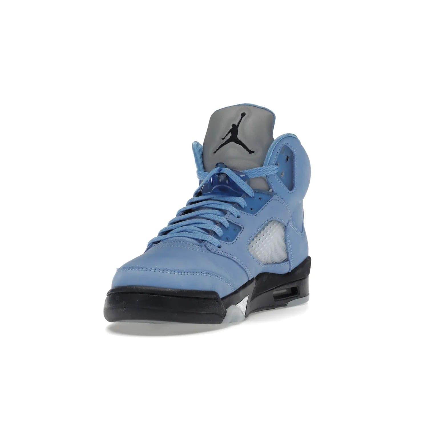 Jordan 5 Retro UNC University Blue - Image 13 - Only at www.BallersClubKickz.com - Fresh Air Jordan 5 Retro UNC University Blue in University Blue laces to honor Michael Jordan's alma mater. 3M reflective tongue, black Jumpman logo, contrasted by black midsole and translucent blue outsole. Drops March 5, 2023.