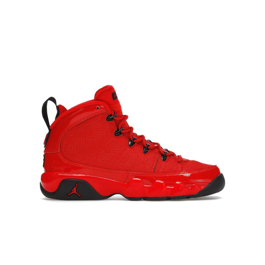 Jordan 9 Retro Chile Red (GS) - Image 1 - Only at www.BallersClubKickz.com - Introducing the Air Jordan 9 Retro Chile Red (GS), a vintage 1993 silhouette with fiery colorway. Features quilted side paneling, glossy patent leather, pull tabs, black contrast accents, and foam midsole. Launching May 2022 for $140.