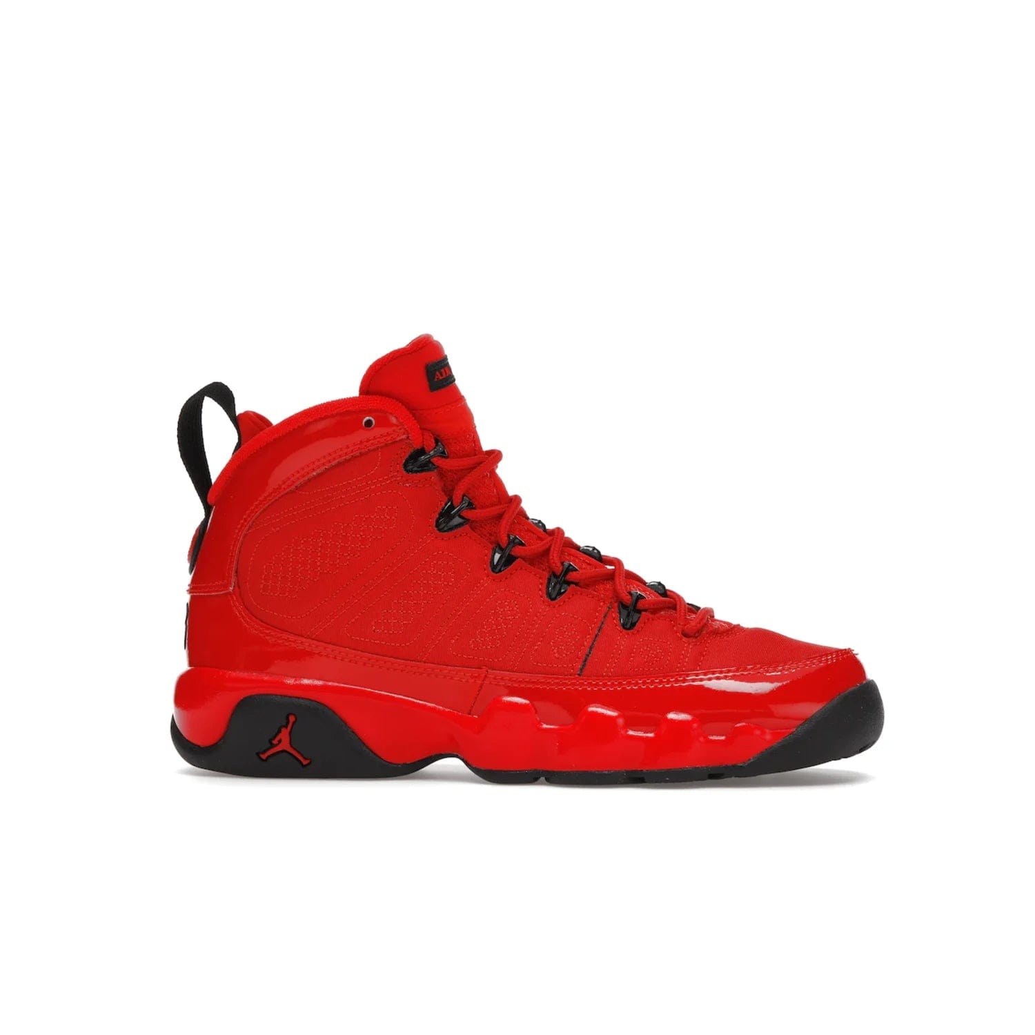 Jordan 9 Retro Chile Red (GS) - Image 2 - Only at www.BallersClubKickz.com - Introducing the Air Jordan 9 Retro Chile Red (GS), a vintage 1993 silhouette with fiery colorway. Features quilted side paneling, glossy patent leather, pull tabs, black contrast accents, and foam midsole. Launching May 2022 for $140.