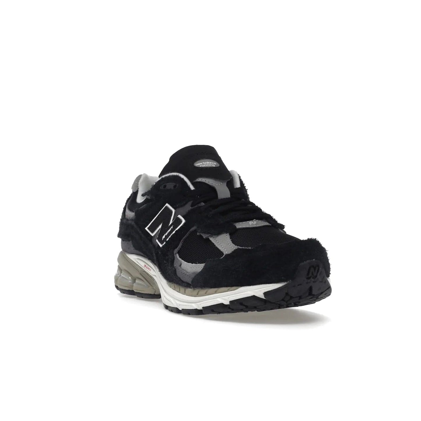 New Balance 2002R Protection Pack Black Grey - Image 7 - Only at www.BallersClubKickz.com - Look stylish in the New Balance 2002R Protection Pack Black Grey. Uppers constructed from premium materials like mesh and synthetic overlays. Iconic "N" emblem appears in white and black. ABZORB midsole for shock absorption and responsiveness. Black outsole for grip and traction. Lacing system offers customized fit and cushioned tongue and collar offer comfort and stability. Step up your style with this must-have