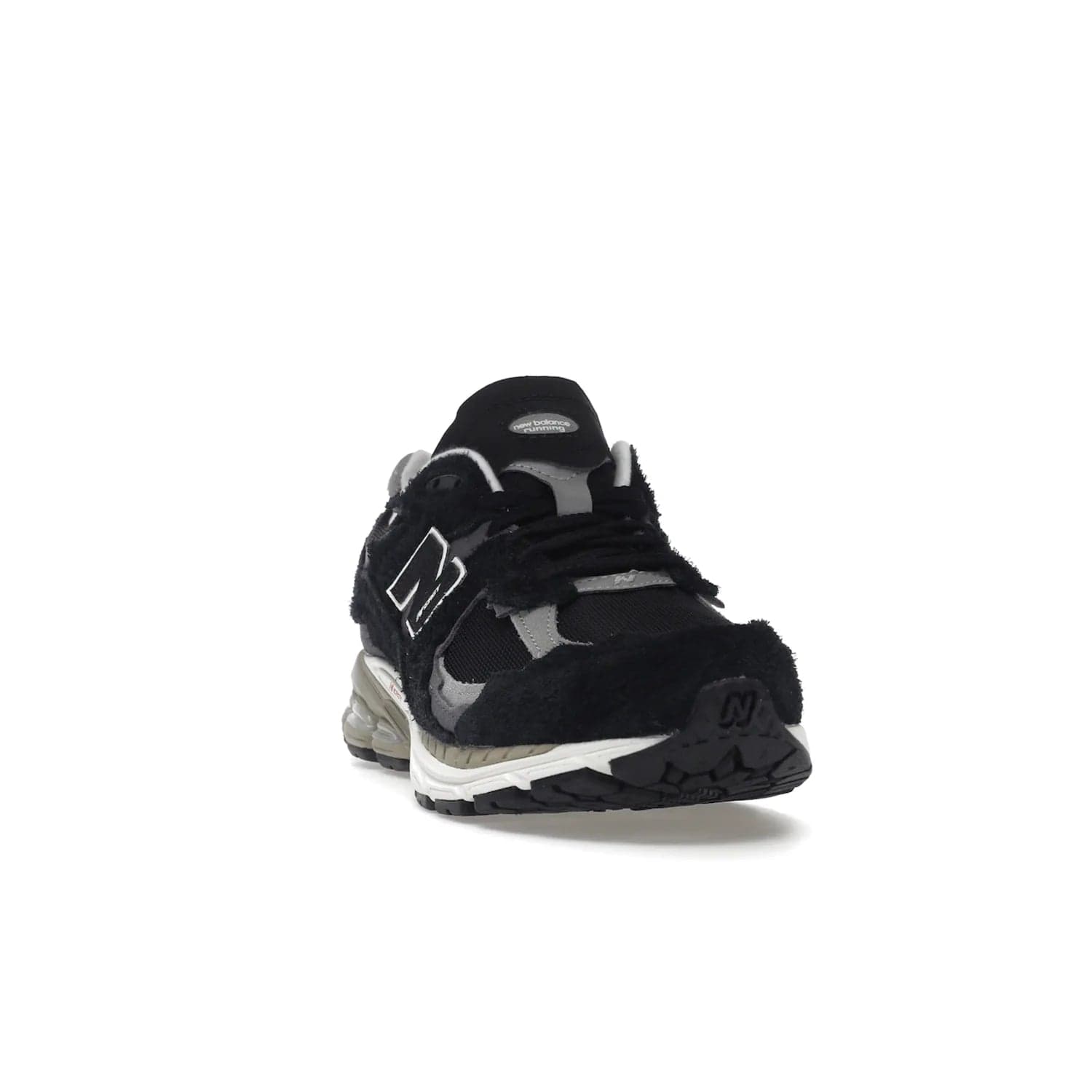 New Balance 2002R Protection Pack Black Grey - Image 8 - Only at www.BallersClubKickz.com - Look stylish in the New Balance 2002R Protection Pack Black Grey. Uppers constructed from premium materials like mesh and synthetic overlays. Iconic "N" emblem appears in white and black. ABZORB midsole for shock absorption and responsiveness. Black outsole for grip and traction. Lacing system offers customized fit and cushioned tongue and collar offer comfort and stability. Step up your style with this must-have