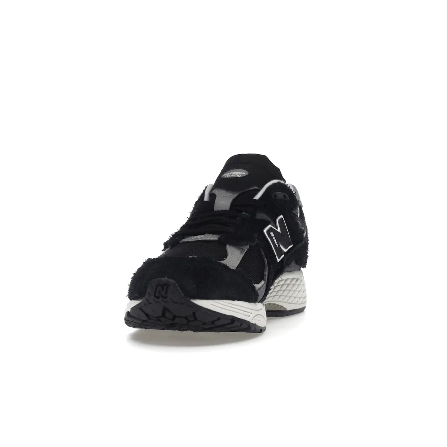 New Balance 2002R Protection Pack Black Grey - Image 12 - Only at www.BallersClubKickz.com - Look stylish in the New Balance 2002R Protection Pack Black Grey. Uppers constructed from premium materials like mesh and synthetic overlays. Iconic "N" emblem appears in white and black. ABZORB midsole for shock absorption and responsiveness. Black outsole for grip and traction. Lacing system offers customized fit and cushioned tongue and collar offer comfort and stability. Step up your style with this must-hav