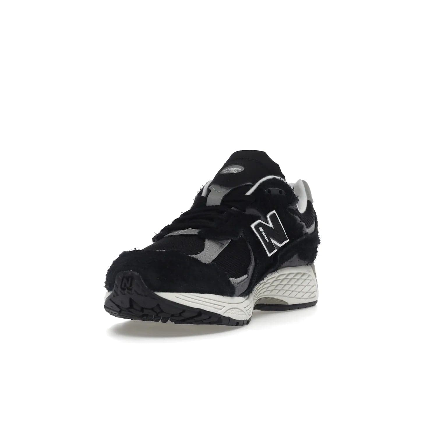 New Balance 2002R Protection Pack Black Grey - Image 13 - Only at www.BallersClubKickz.com - Look stylish in the New Balance 2002R Protection Pack Black Grey. Uppers constructed from premium materials like mesh and synthetic overlays. Iconic "N" emblem appears in white and black. ABZORB midsole for shock absorption and responsiveness. Black outsole for grip and traction. Lacing system offers customized fit and cushioned tongue and collar offer comfort and stability. Step up your style with this must-hav