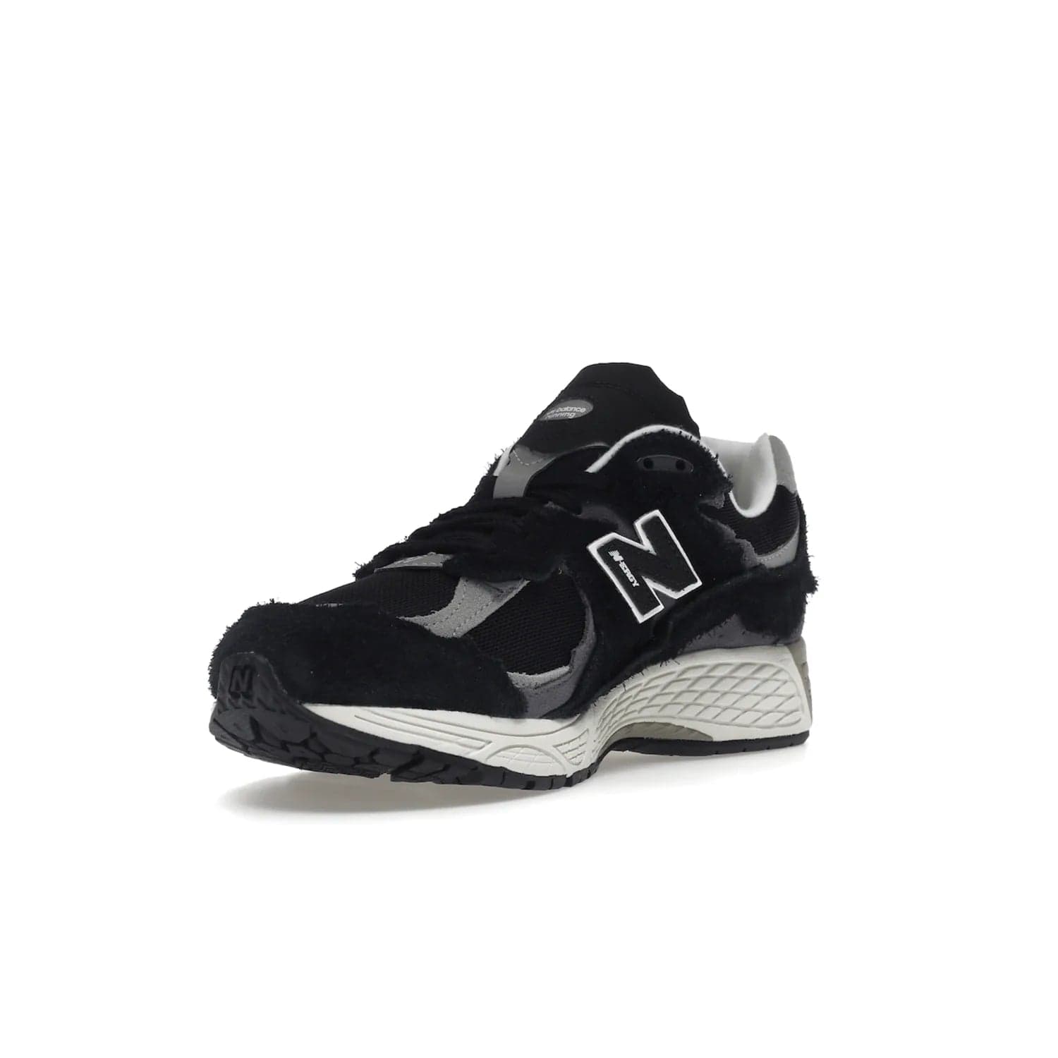 New Balance 2002R Protection Pack Black Grey - Image 14 - Only at www.BallersClubKickz.com - Look stylish in the New Balance 2002R Protection Pack Black Grey. Uppers constructed from premium materials like mesh and synthetic overlays. Iconic "N" emblem appears in white and black. ABZORB midsole for shock absorption and responsiveness. Black outsole for grip and traction. Lacing system offers customized fit and cushioned tongue and collar offer comfort and stability. Step up your style with this must-hav