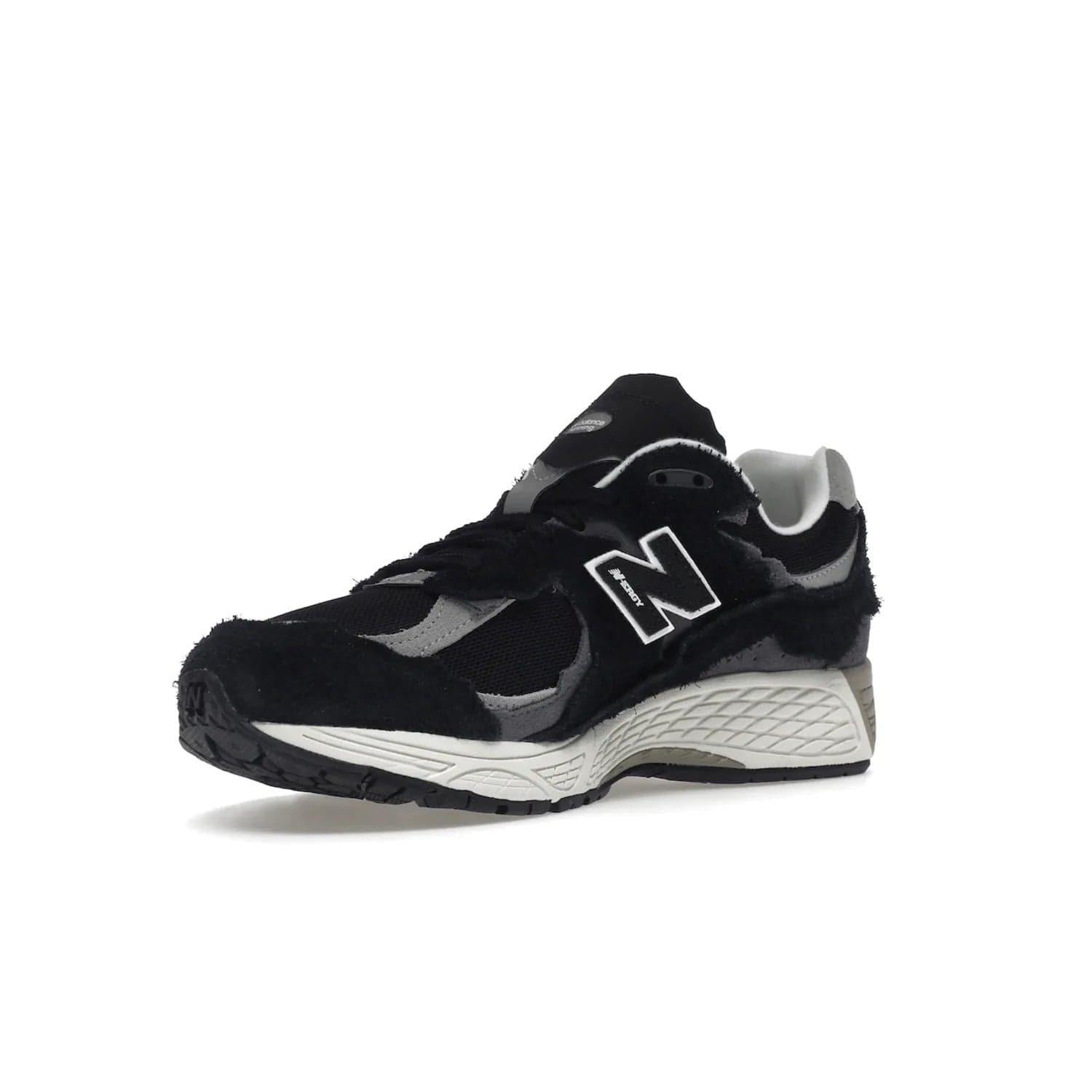 New Balance 2002R Protection Pack Black Grey - Image 15 - Only at www.BallersClubKickz.com - Look stylish in the New Balance 2002R Protection Pack Black Grey. Uppers constructed from premium materials like mesh and synthetic overlays. Iconic "N" emblem appears in white and black. ABZORB midsole for shock absorption and responsiveness. Black outsole for grip and traction. Lacing system offers customized fit and cushioned tongue and collar offer comfort and stability. Step up your style with this must-hav