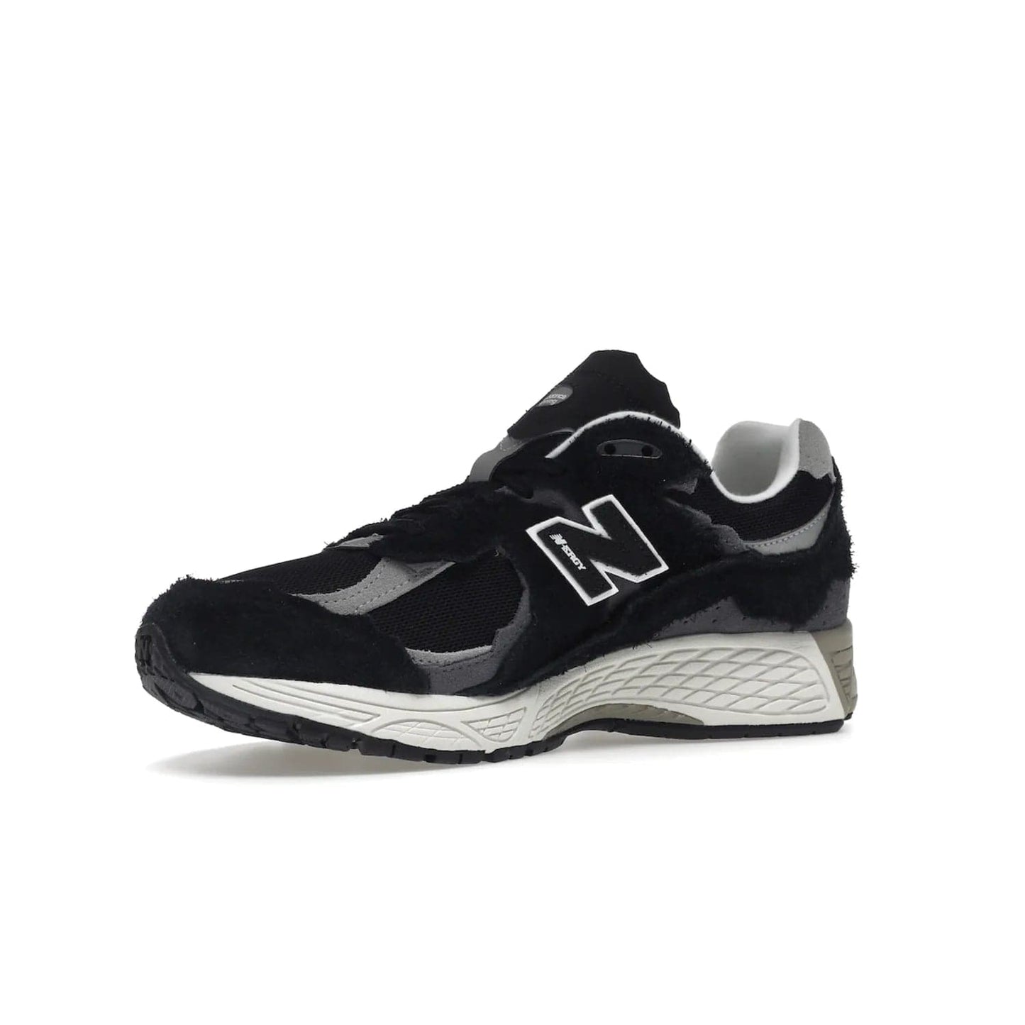 New Balance 2002R Protection Pack Black Grey - Image 16 - Only at www.BallersClubKickz.com - Look stylish in the New Balance 2002R Protection Pack Black Grey. Uppers constructed from premium materials like mesh and synthetic overlays. Iconic "N" emblem appears in white and black. ABZORB midsole for shock absorption and responsiveness. Black outsole for grip and traction. Lacing system offers customized fit and cushioned tongue and collar offer comfort and stability. Step up your style with this must-hav