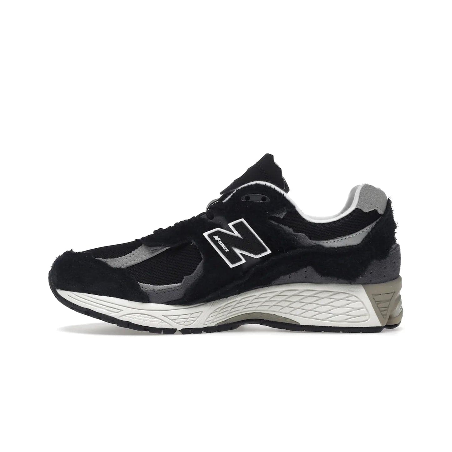 New Balance 2002R Protection Pack Black Grey - Image 19 - Only at www.BallersClubKickz.com - Look stylish in the New Balance 2002R Protection Pack Black Grey. Uppers constructed from premium materials like mesh and synthetic overlays. Iconic "N" emblem appears in white and black. ABZORB midsole for shock absorption and responsiveness. Black outsole for grip and traction. Lacing system offers customized fit and cushioned tongue and collar offer comfort and stability. Step up your style with this must-hav