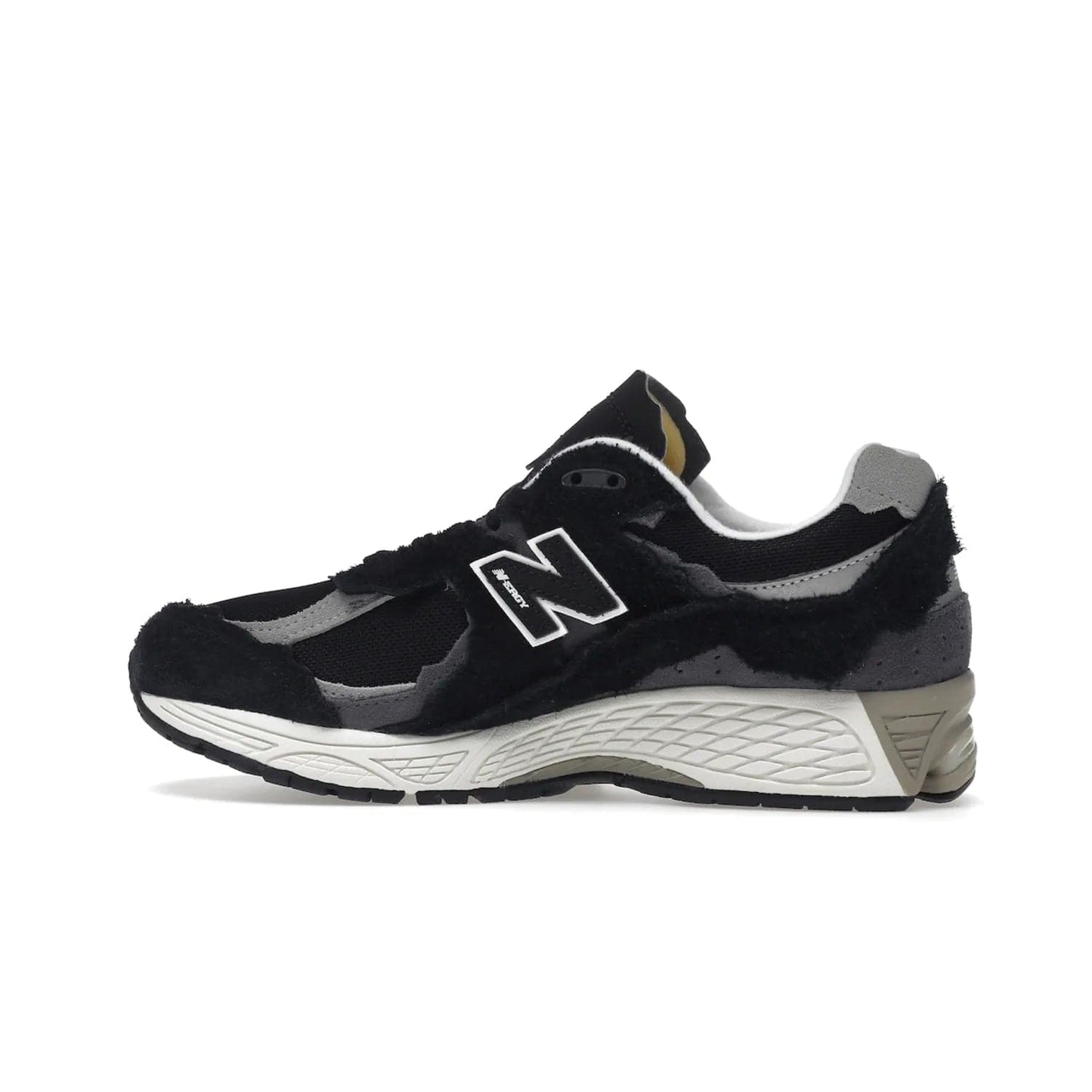 New Balance 2002R Protection Pack Black Grey - Image 20 - Only at www.BallersClubKickz.com - Look stylish in the New Balance 2002R Protection Pack Black Grey. Uppers constructed from premium materials like mesh and synthetic overlays. Iconic "N" emblem appears in white and black. ABZORB midsole for shock absorption and responsiveness. Black outsole for grip and traction. Lacing system offers customized fit and cushioned tongue and collar offer comfort and stability. Step up your style with this must-hav