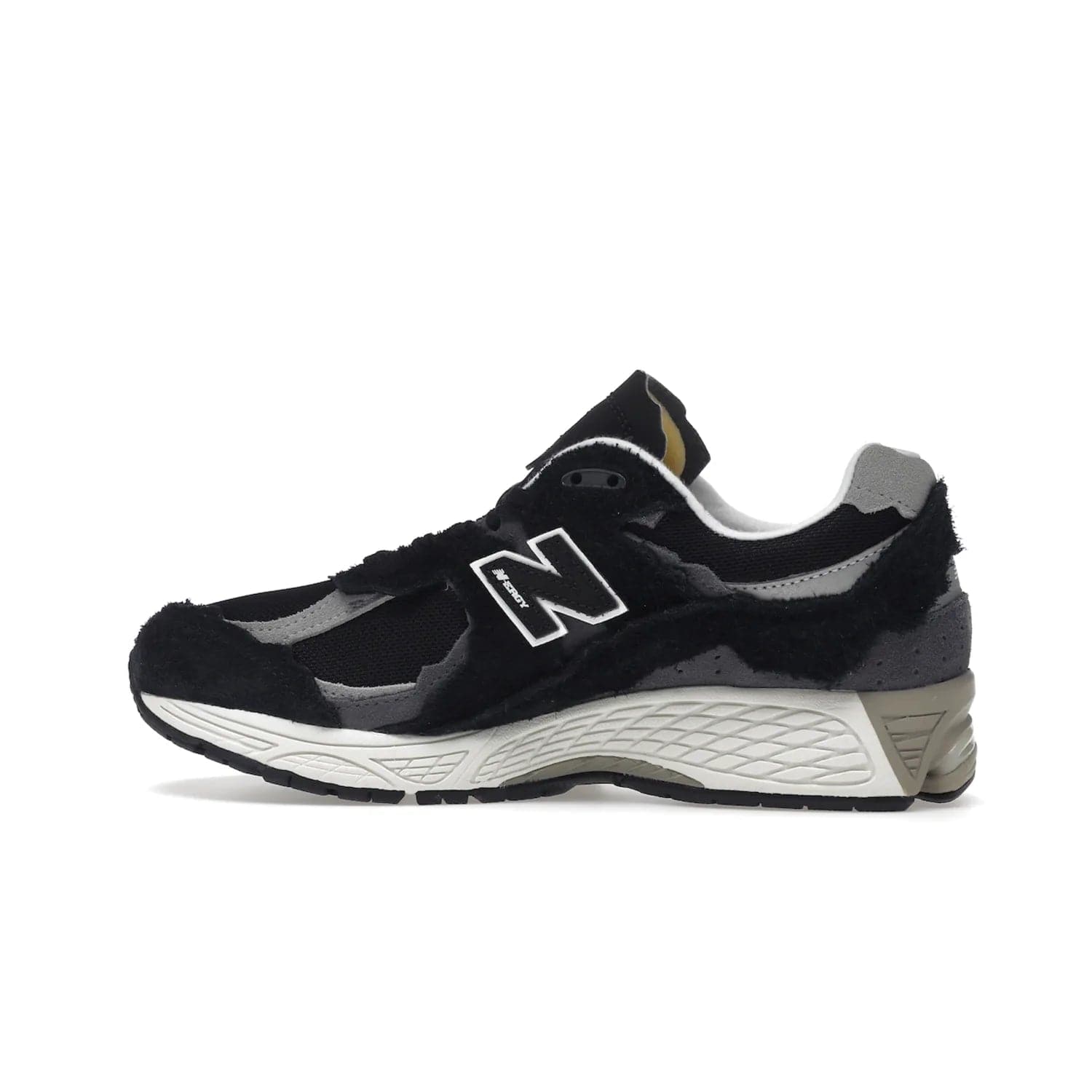 New Balance 2002R Protection Pack Black Grey - Image 20 - Only at www.BallersClubKickz.com - Look stylish in the New Balance 2002R Protection Pack Black Grey. Uppers constructed from premium materials like mesh and synthetic overlays. Iconic "N" emblem appears in white and black. ABZORB midsole for shock absorption and responsiveness. Black outsole for grip and traction. Lacing system offers customized fit and cushioned tongue and collar offer comfort and stability. Step up your style with this must-hav