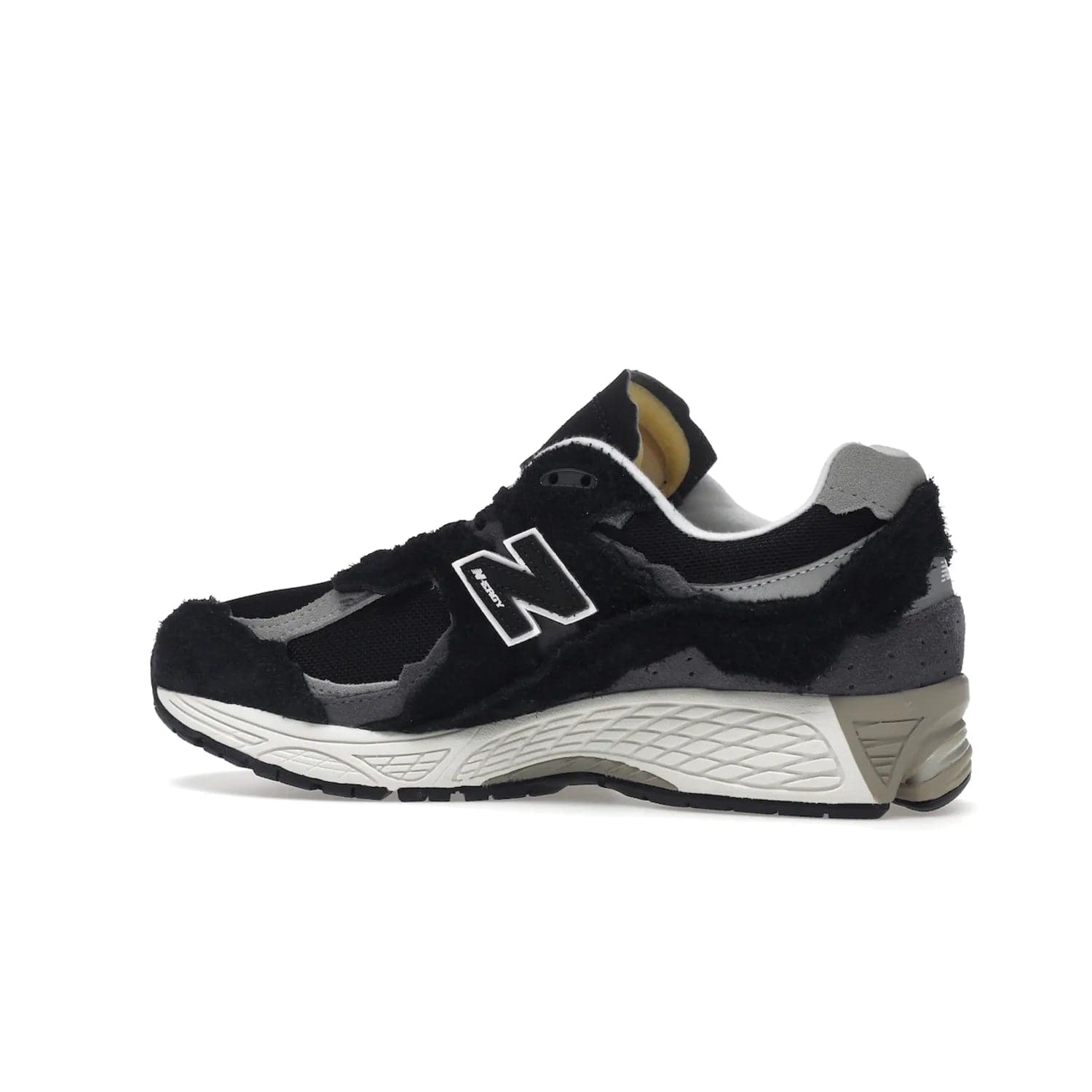 New Balance 2002R Protection Pack Black Grey - Image 21 - Only at www.BallersClubKickz.com - Look stylish in the New Balance 2002R Protection Pack Black Grey. Uppers constructed from premium materials like mesh and synthetic overlays. Iconic "N" emblem appears in white and black. ABZORB midsole for shock absorption and responsiveness. Black outsole for grip and traction. Lacing system offers customized fit and cushioned tongue and collar offer comfort and stability. Step up your style with this must-hav