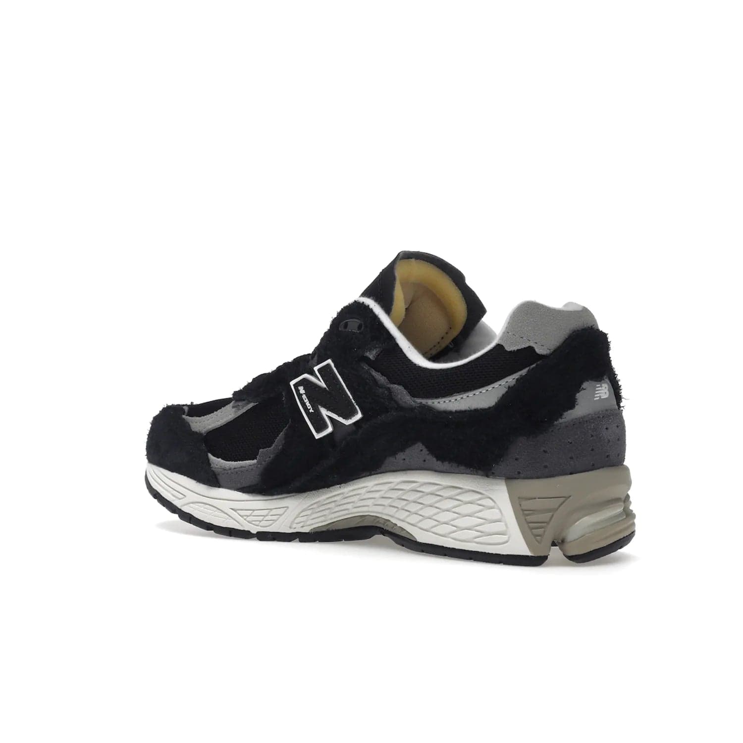 New Balance 2002R Protection Pack Black Grey - Image 23 - Only at www.BallersClubKickz.com - Look stylish in the New Balance 2002R Protection Pack Black Grey. Uppers constructed from premium materials like mesh and synthetic overlays. Iconic "N" emblem appears in white and black. ABZORB midsole for shock absorption and responsiveness. Black outsole for grip and traction. Lacing system offers customized fit and cushioned tongue and collar offer comfort and stability. Step up your style with this must-hav