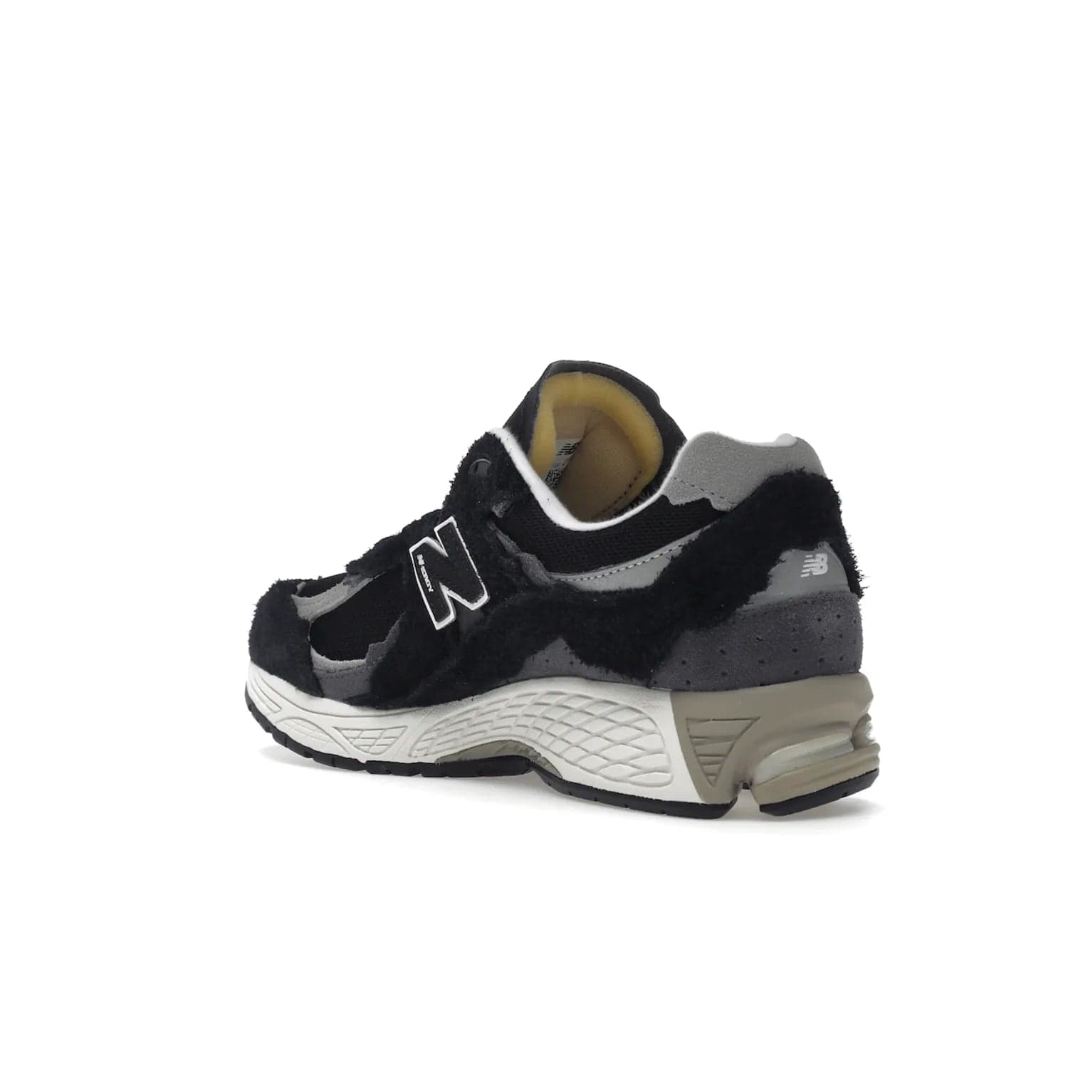 New Balance 2002R Protection Pack Black Grey - Image 24 - Only at www.BallersClubKickz.com - Look stylish in the New Balance 2002R Protection Pack Black Grey. Uppers constructed from premium materials like mesh and synthetic overlays. Iconic "N" emblem appears in white and black. ABZORB midsole for shock absorption and responsiveness. Black outsole for grip and traction. Lacing system offers customized fit and cushioned tongue and collar offer comfort and stability. Step up your style with this must-hav
