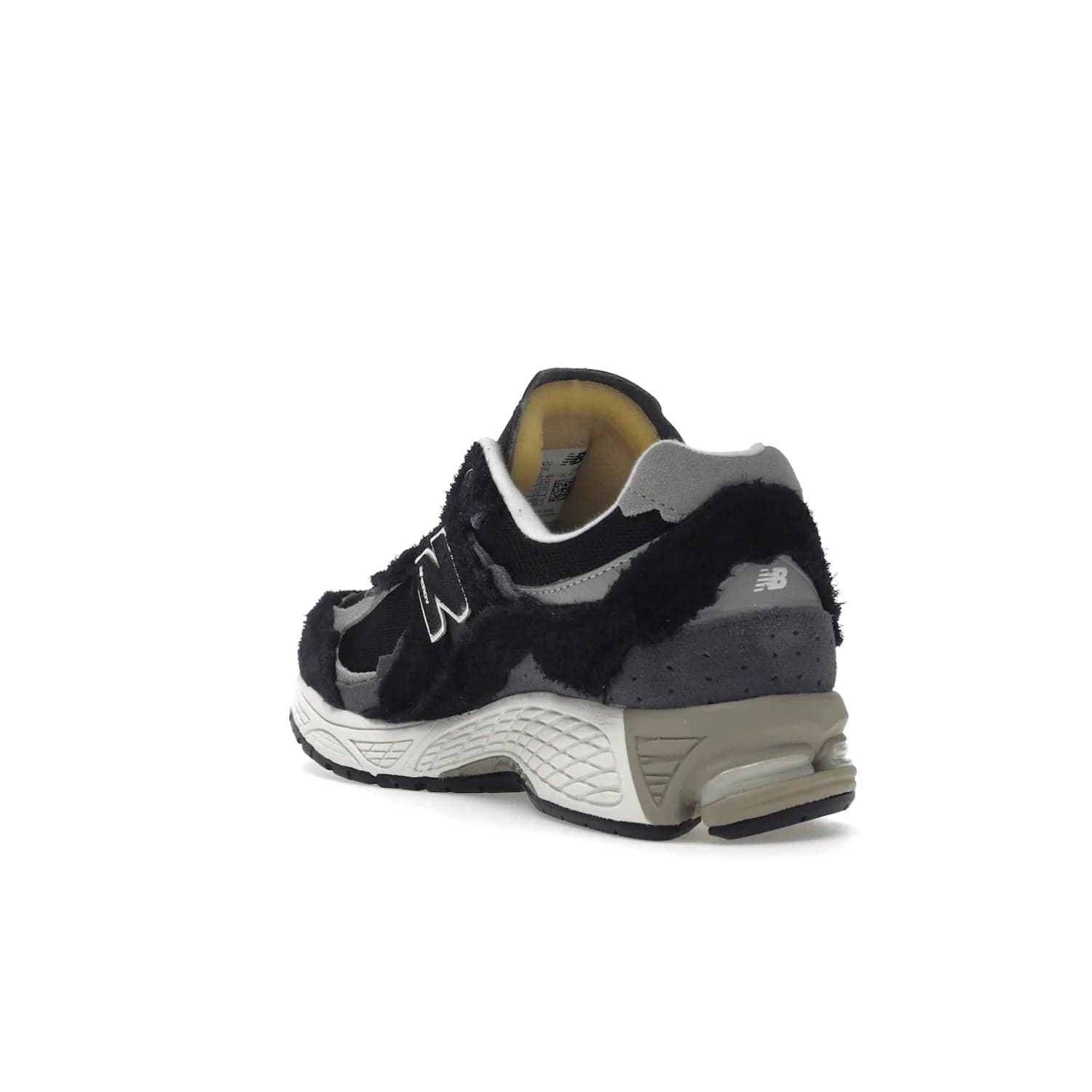 New Balance 2002R Protection Pack Black Grey - Image 25 - Only at www.BallersClubKickz.com - Look stylish in the New Balance 2002R Protection Pack Black Grey. Uppers constructed from premium materials like mesh and synthetic overlays. Iconic "N" emblem appears in white and black. ABZORB midsole for shock absorption and responsiveness. Black outsole for grip and traction. Lacing system offers customized fit and cushioned tongue and collar offer comfort and stability. Step up your style with this must-hav