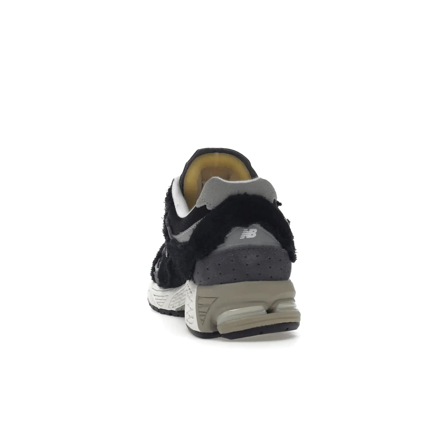 New Balance 2002R Protection Pack Black Grey - Image 27 - Only at www.BallersClubKickz.com - Look stylish in the New Balance 2002R Protection Pack Black Grey. Uppers constructed from premium materials like mesh and synthetic overlays. Iconic "N" emblem appears in white and black. ABZORB midsole for shock absorption and responsiveness. Black outsole for grip and traction. Lacing system offers customized fit and cushioned tongue and collar offer comfort and stability. Step up your style with this must-hav