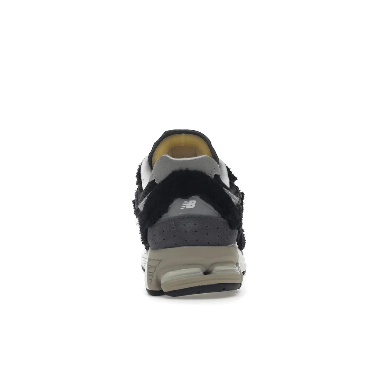 New Balance 2002R Protection Pack Black Grey - Image 28 - Only at www.BallersClubKickz.com - Look stylish in the New Balance 2002R Protection Pack Black Grey. Uppers constructed from premium materials like mesh and synthetic overlays. Iconic "N" emblem appears in white and black. ABZORB midsole for shock absorption and responsiveness. Black outsole for grip and traction. Lacing system offers customized fit and cushioned tongue and collar offer comfort and stability. Step up your style with this must-hav