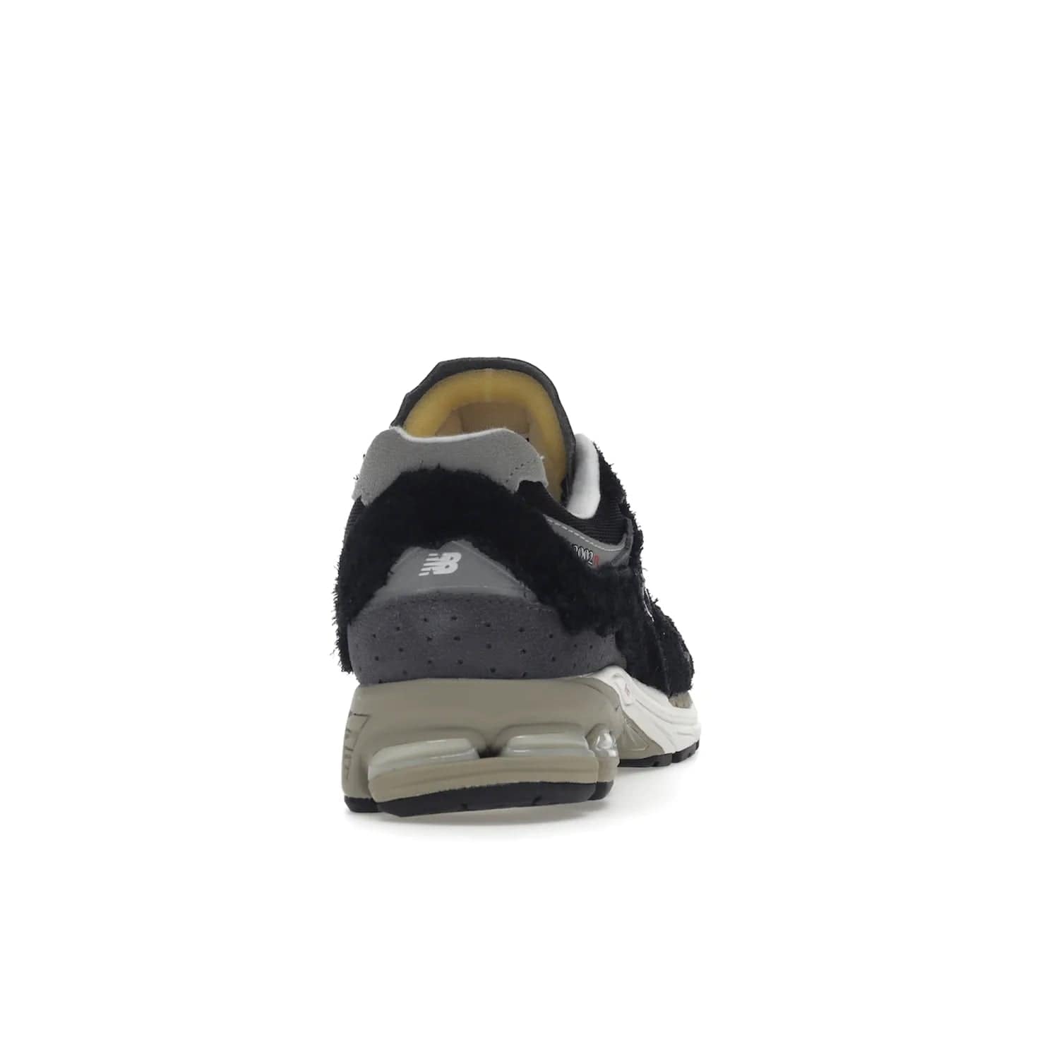 New Balance 2002R Protection Pack Black Grey - Image 29 - Only at www.BallersClubKickz.com - Look stylish in the New Balance 2002R Protection Pack Black Grey. Uppers constructed from premium materials like mesh and synthetic overlays. Iconic "N" emblem appears in white and black. ABZORB midsole for shock absorption and responsiveness. Black outsole for grip and traction. Lacing system offers customized fit and cushioned tongue and collar offer comfort and stability. Step up your style with this must-hav