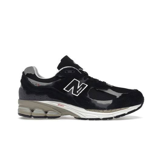 New Balance 2002R Protection Pack Black Grey - Image 1 - Only at www.BallersClubKickz.com - Look stylish in the New Balance 2002R Protection Pack Black Grey. Uppers constructed from premium materials like mesh and synthetic overlays. Iconic "N" emblem appears in white and black. ABZORB midsole for shock absorption and responsiveness. Black outsole for grip and traction. Lacing system offers customized fit and cushioned tongue and collar offer comfort and stability. Step up your style with this must-have
