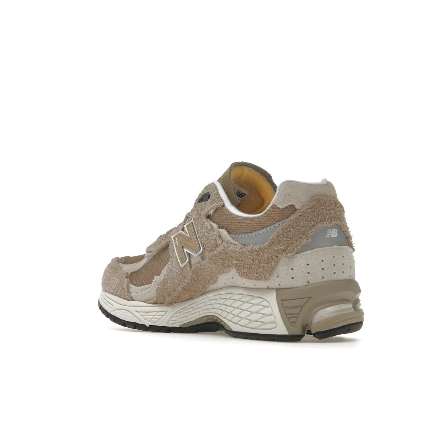 New Balance 2002R Protection Pack Driftwood - Image 24 - Only at www.BallersClubKickz.com - The New Balance 2002R Driftwood Protection Pack is a fashionable yet comfortable sneaker perfect for any occasion. Features include hairy suede uppers, breathable mesh, underfoot support, 3M reflective details, and more. Stylishly dress up your look with this shoe, available March 2023.