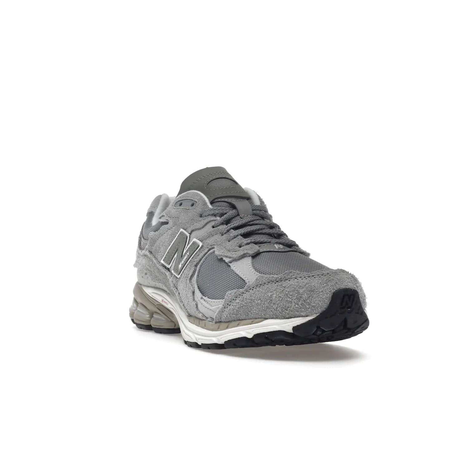 New Balance 2002R Protection Pack Grey - Image 7 - Only at www.BallersClubKickz.com - The New Balance 2002R Protection Pack Grey provides superior protection and all-day comfort. It features a blend of synthetic and mesh materials, foam midsole, rubber outsole, and a toe cap and heel counter. Show off the classic "N" logo and "2002R" lettering. Get a pair on February 14, 2023 for protection and style.