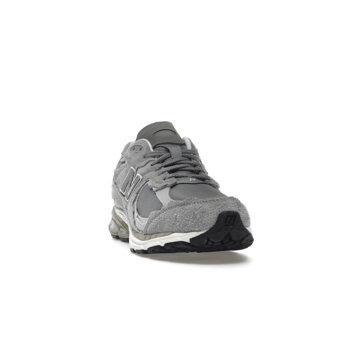 New Balance 2002R Protection Pack Grey - Image 8 - Only at www.BallersClubKickz.com - The New Balance 2002R Protection Pack Grey provides superior protection and all-day comfort. It features a blend of synthetic and mesh materials, foam midsole, rubber outsole, and a toe cap and heel counter. Show off the classic "N" logo and "2002R" lettering. Get a pair on February 14, 2023 for protection and style.