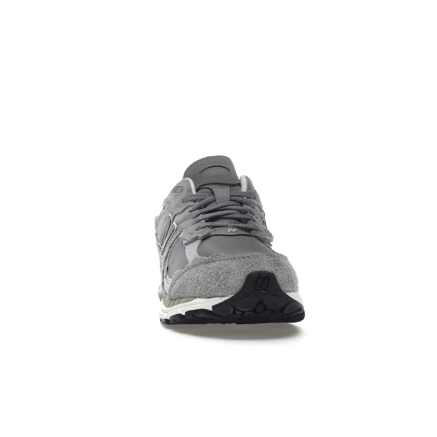 New Balance 2002R Protection Pack Grey - Image 9 - Only at www.BallersClubKickz.com - The New Balance 2002R Protection Pack Grey provides superior protection and all-day comfort. It features a blend of synthetic and mesh materials, foam midsole, rubber outsole, and a toe cap and heel counter. Show off the classic "N" logo and "2002R" lettering. Get a pair on February 14, 2023 for protection and style.