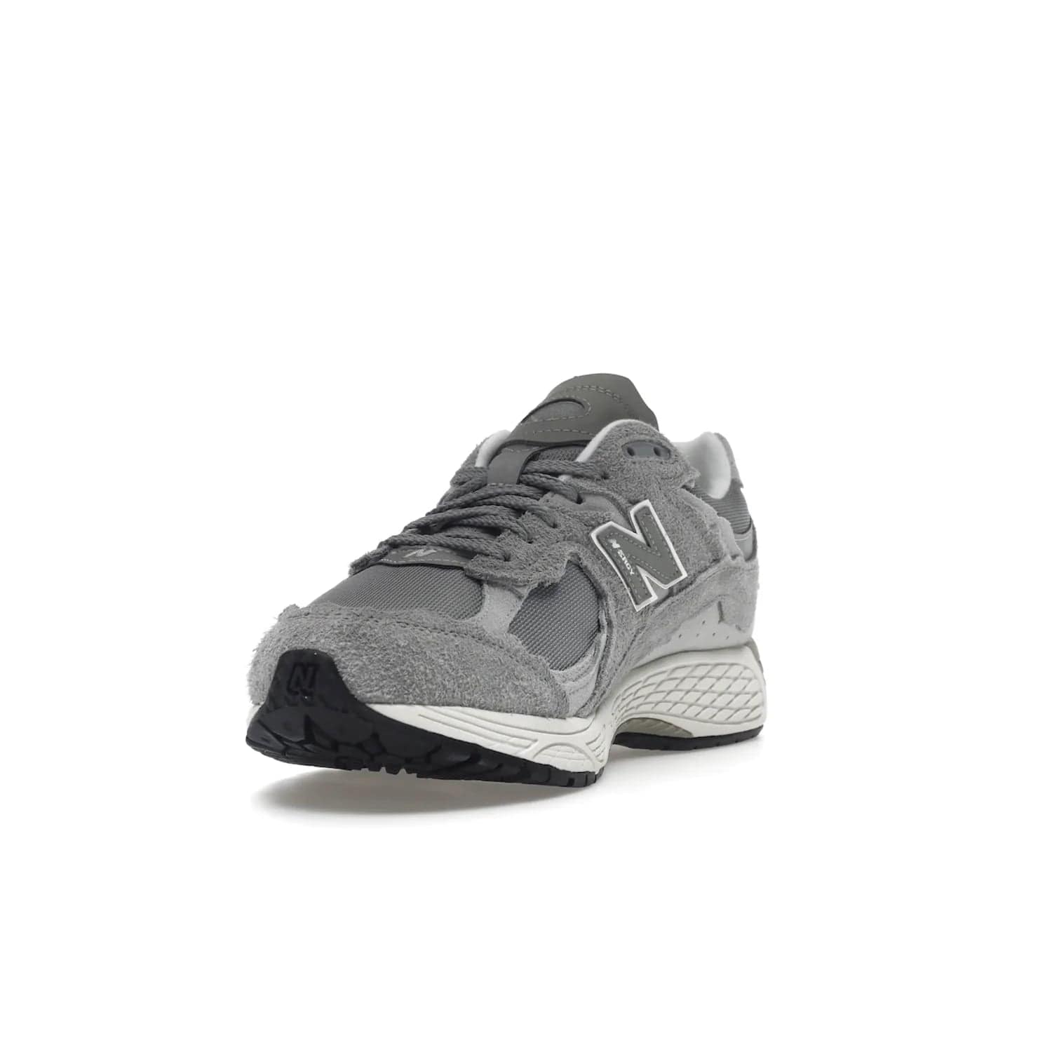 New Balance 2002R Protection Pack Grey - Image 13 - Only at www.BallersClubKickz.com - The New Balance 2002R Protection Pack Grey provides superior protection and all-day comfort. It features a blend of synthetic and mesh materials, foam midsole, rubber outsole, and a toe cap and heel counter. Show off the classic "N" logo and "2002R" lettering. Get a pair on February 14, 2023 for protection and style.