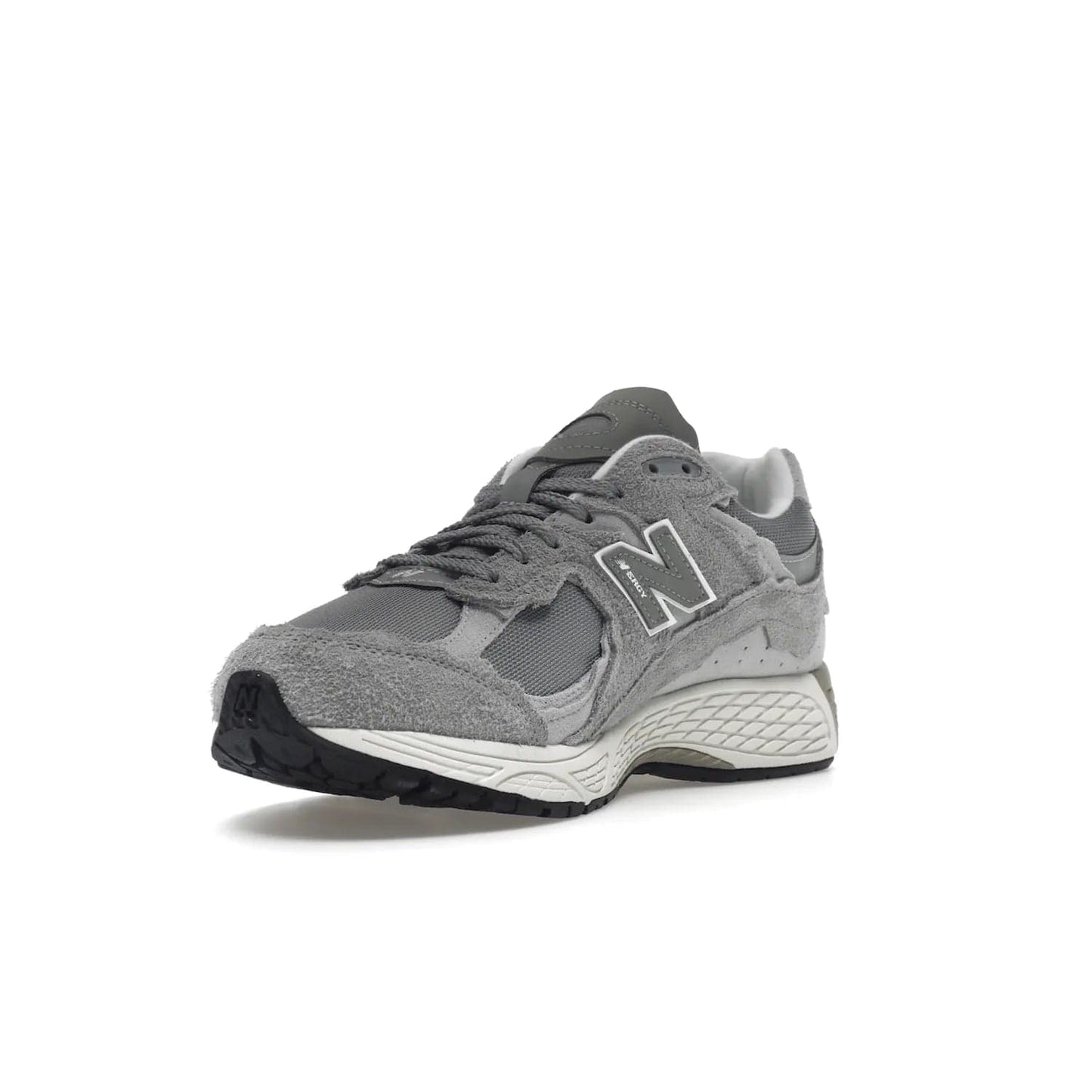 New Balance 2002R Protection Pack Grey - Image 14 - Only at www.BallersClubKickz.com - The New Balance 2002R Protection Pack Grey provides superior protection and all-day comfort. It features a blend of synthetic and mesh materials, foam midsole, rubber outsole, and a toe cap and heel counter. Show off the classic "N" logo and "2002R" lettering. Get a pair on February 14, 2023 for protection and style.