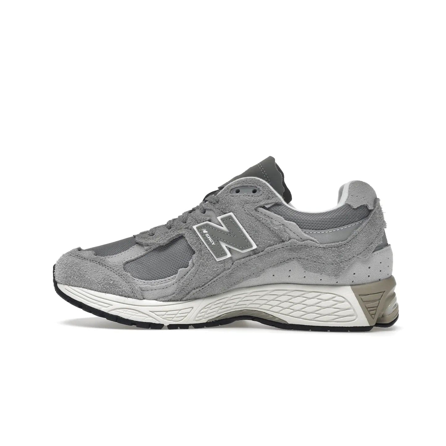 New Balance 2002R Protection Pack Grey - Image 20 - Only at www.BallersClubKickz.com - The New Balance 2002R Protection Pack Grey provides superior protection and all-day comfort. It features a blend of synthetic and mesh materials, foam midsole, rubber outsole, and a toe cap and heel counter. Show off the classic "N" logo and "2002R" lettering. Get a pair on February 14, 2023 for protection and style.