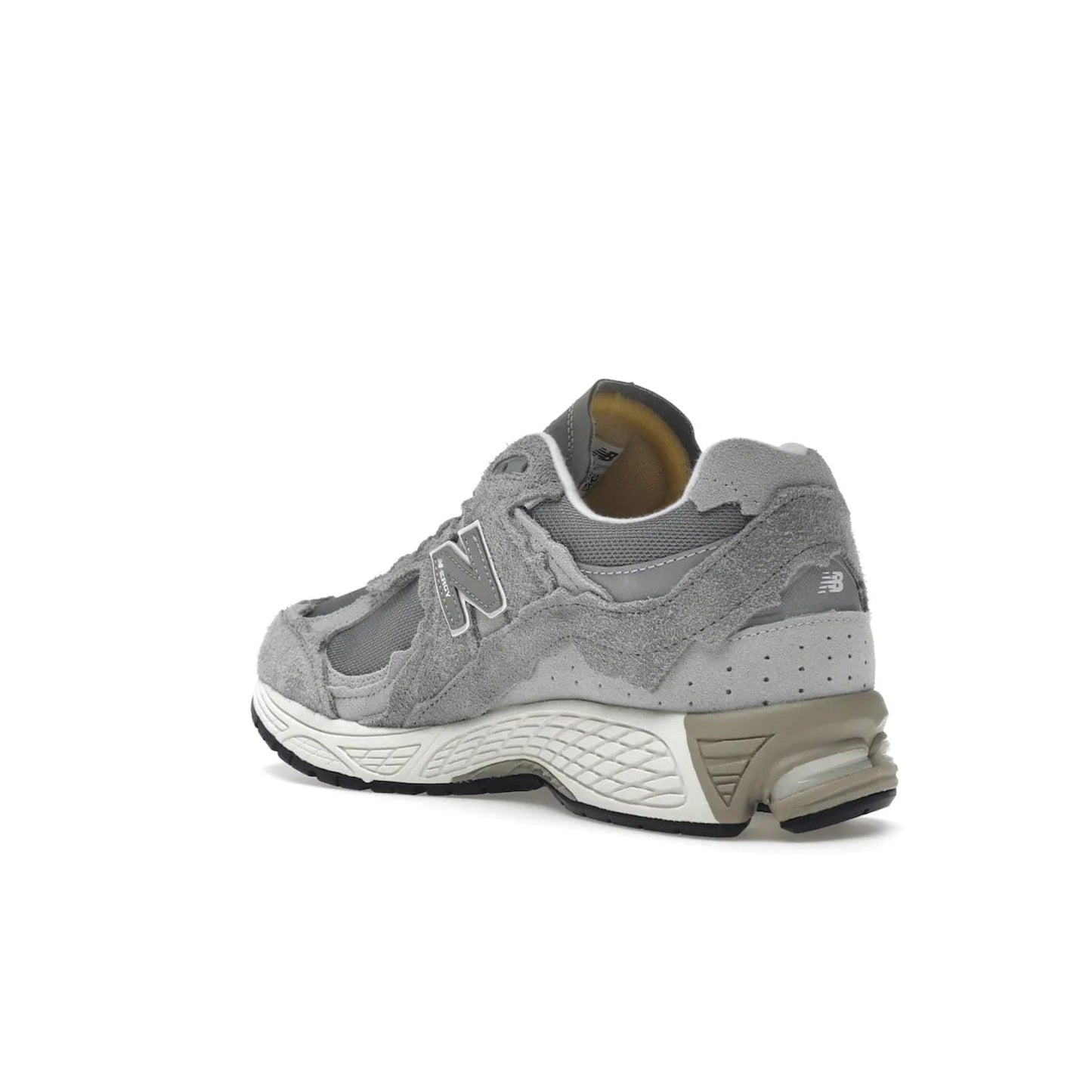 New Balance 2002R Protection Pack Grey - Image 24 - Only at www.BallersClubKickz.com - The New Balance 2002R Protection Pack Grey provides superior protection and all-day comfort. It features a blend of synthetic and mesh materials, foam midsole, rubber outsole, and a toe cap and heel counter. Show off the classic "N" logo and "2002R" lettering. Get a pair on February 14, 2023 for protection and style.