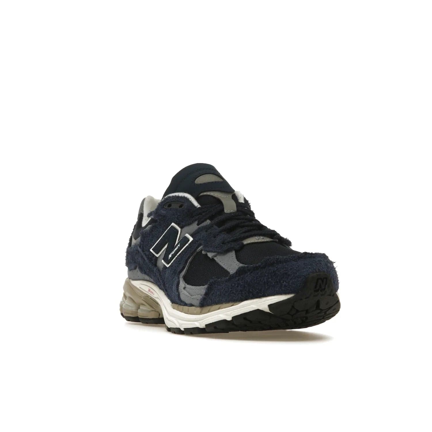 New Balance 2002R Protection Pack Navy Grey - Image 7 - Only at www.BallersClubKickz.com - Get the New Balance 2002R Protection Pack Navy Grey for a statement look. Crafted by Yue Wu, this sneaker features a mesh base, navy suede overlays, and a white and earth midsole. Released Feb 14, 2023.