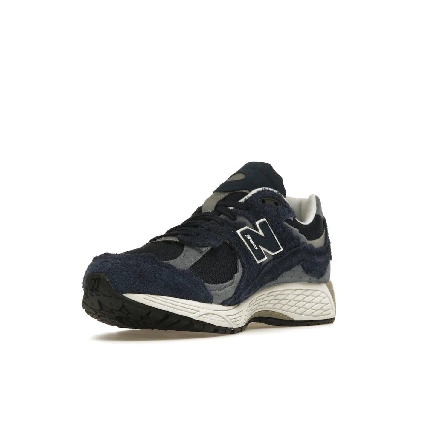 New Balance 2002R Protection Pack Navy Grey - Image 14 - Only at www.BallersClubKickz.com - Get the New Balance 2002R Protection Pack Navy Grey for a statement look. Crafted by Yue Wu, this sneaker features a mesh base, navy suede overlays, and a white and earth midsole. Released Feb 14, 2023.