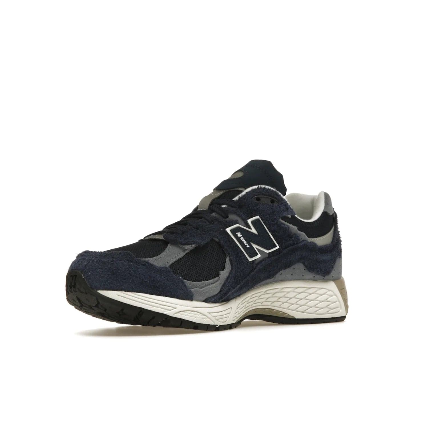 New Balance 2002R Protection Pack Navy Grey - Image 15 - Only at www.BallersClubKickz.com - Get the New Balance 2002R Protection Pack Navy Grey for a statement look. Crafted by Yue Wu, this sneaker features a mesh base, navy suede overlays, and a white and earth midsole. Released Feb 14, 2023.