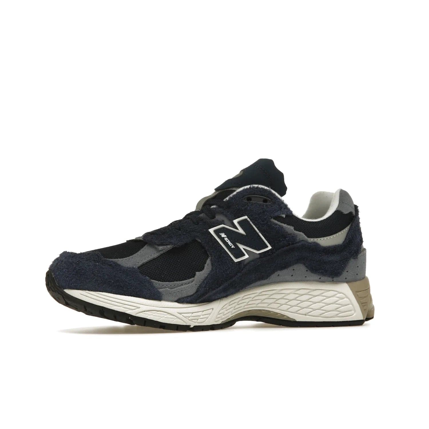New Balance 2002R Protection Pack Navy Grey - Image 17 - Only at www.BallersClubKickz.com - Get the New Balance 2002R Protection Pack Navy Grey for a statement look. Crafted by Yue Wu, this sneaker features a mesh base, navy suede overlays, and a white and earth midsole. Released Feb 14, 2023.