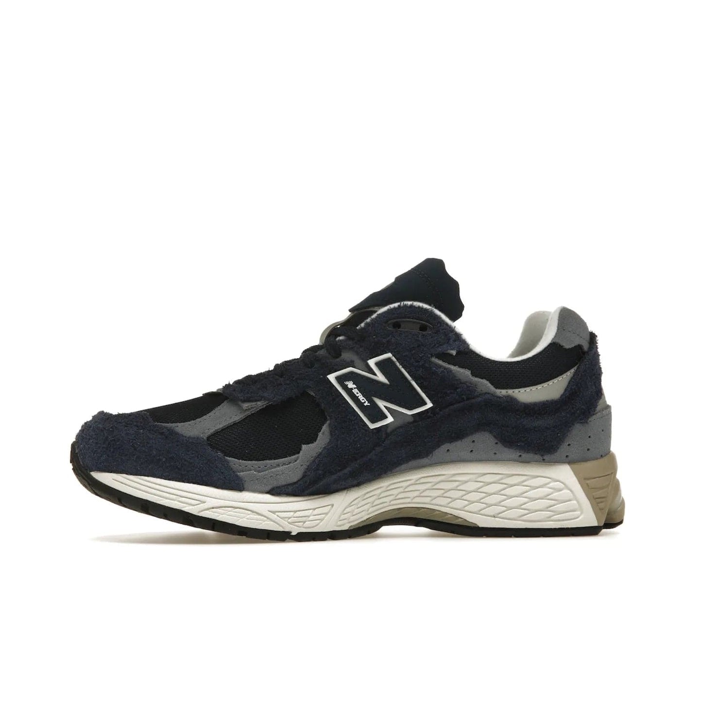 New Balance 2002R Protection Pack Navy Grey - Image 18 - Only at www.BallersClubKickz.com - Get the New Balance 2002R Protection Pack Navy Grey for a statement look. Crafted by Yue Wu, this sneaker features a mesh base, navy suede overlays, and a white and earth midsole. Released Feb 14, 2023.