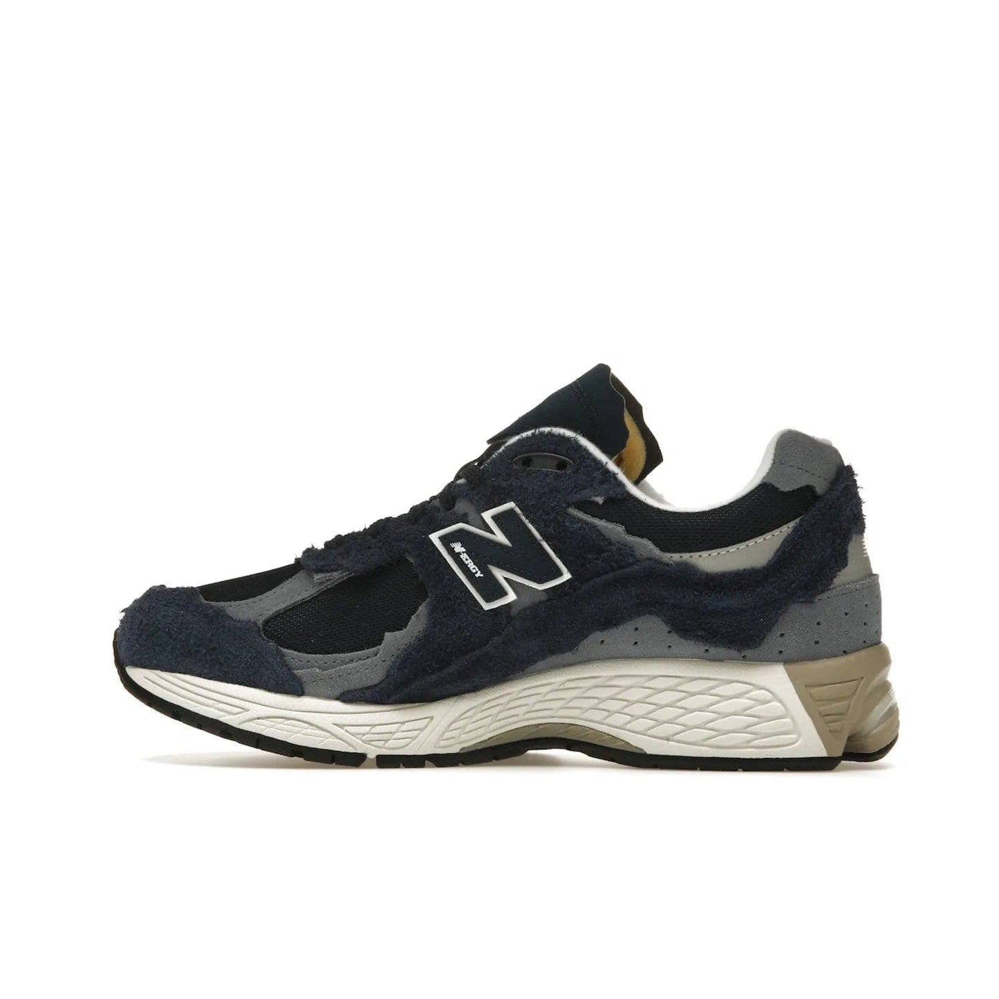 New Balance 2002R Protection Pack Navy Grey - Image 20 - Only at www.BallersClubKickz.com - Get the New Balance 2002R Protection Pack Navy Grey for a statement look. Crafted by Yue Wu, this sneaker features a mesh base, navy suede overlays, and a white and earth midsole. Released Feb 14, 2023.