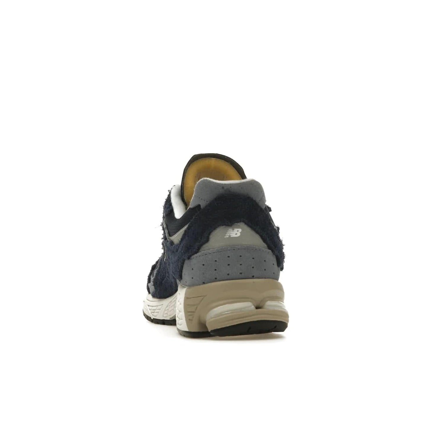 New Balance 2002R Protection Pack Navy Grey - Image 27 - Only at www.BallersClubKickz.com - Get the New Balance 2002R Protection Pack Navy Grey for a statement look. Crafted by Yue Wu, this sneaker features a mesh base, navy suede overlays, and a white and earth midsole. Released Feb 14, 2023.