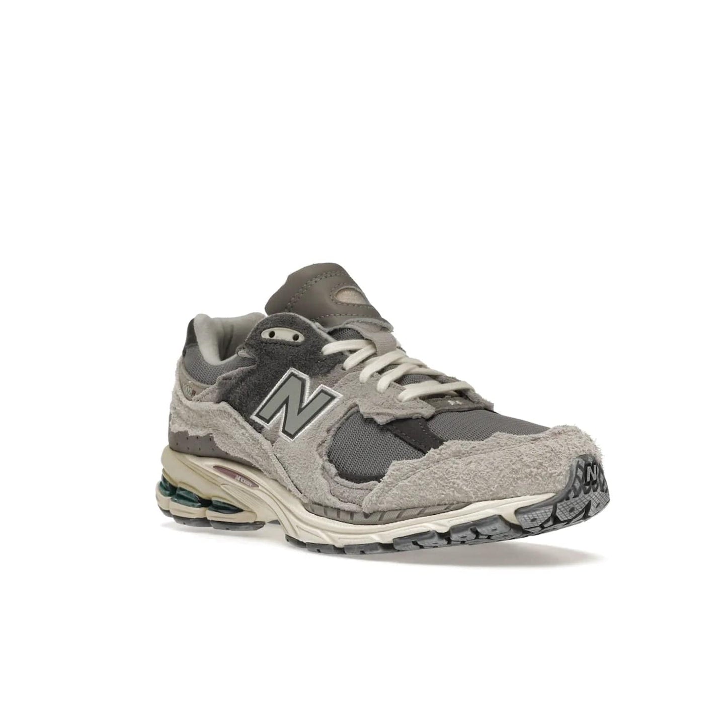 New Balance 2002R Protection Pack Rain Cloud - Image 6 - Only at www.BallersClubKickz.com - The New Balance 2002R Protection Pack Rain Cloud combines style and comfort. Featuring a grey mesh upper, jagged suede overlays and a reflective logo, a vibrant rain cloud motif on the heel stands out! Not just good-looking, the Nrgy midsole and soft grey outsole provide cushioning and comfort. Make a statement with the iconic New Balance 2002R Protection Pack Rain Cloud.