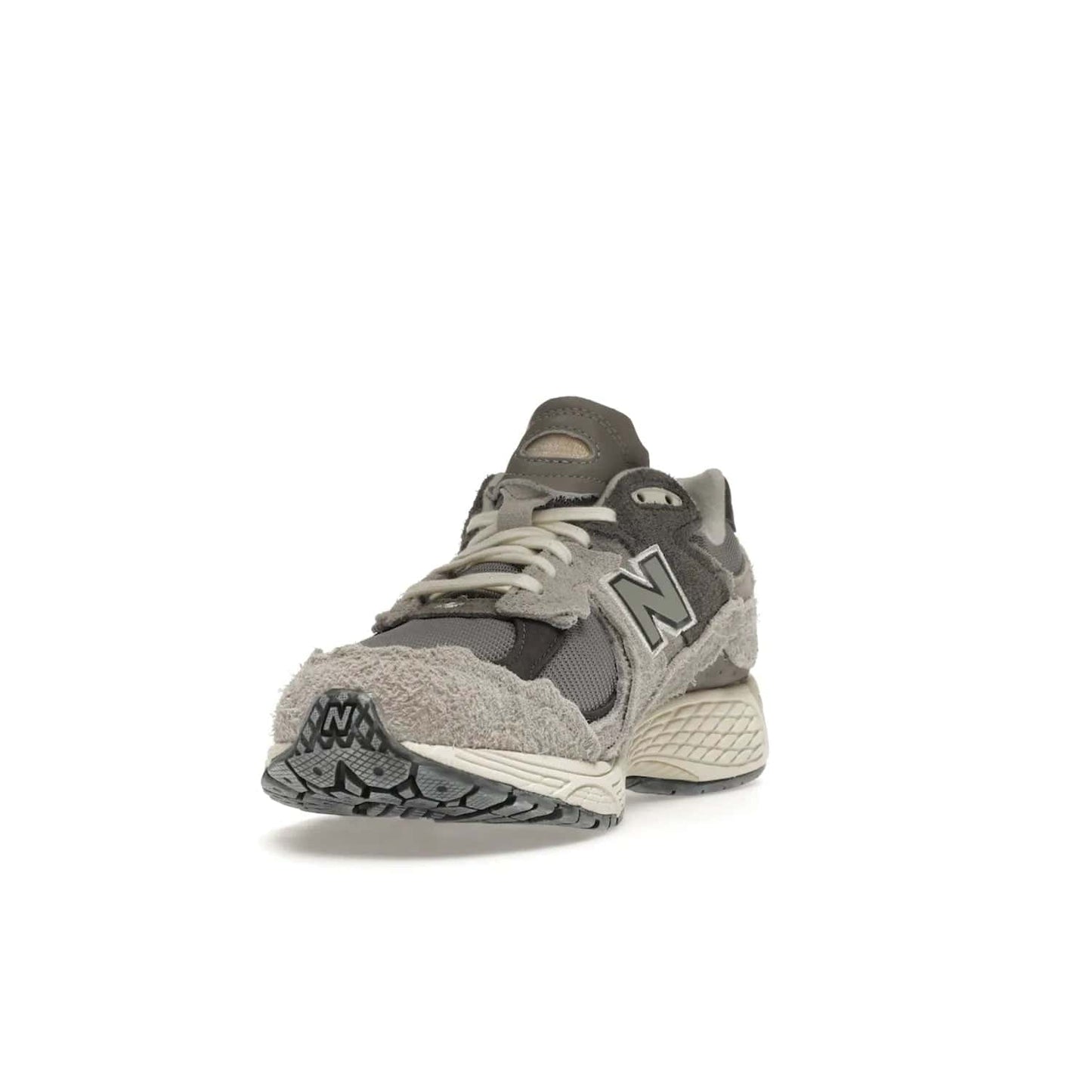 New Balance 2002R Protection Pack Rain Cloud - Image 13 - Only at www.BallersClubKickz.com - The New Balance 2002R Protection Pack Rain Cloud combines style and comfort. Featuring a grey mesh upper, jagged suede overlays and a reflective logo, a vibrant rain cloud motif on the heel stands out! Not just good-looking, the Nrgy midsole and soft grey outsole provide cushioning and comfort. Make a statement with the iconic New Balance 2002R Protection Pack Rain Cloud.