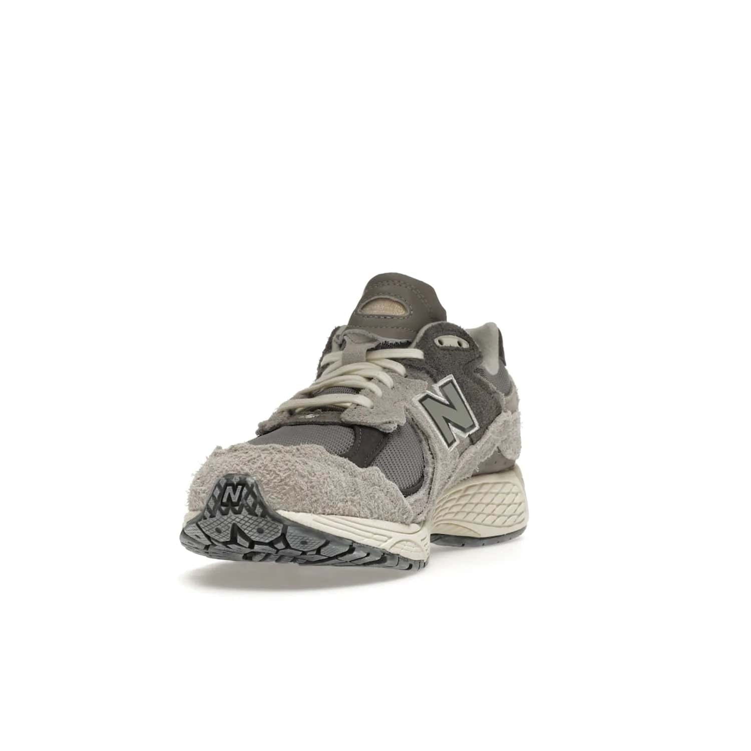 New Balance 2002R Protection Pack Rain Cloud - Image 13 - Only at www.BallersClubKickz.com - The New Balance 2002R Protection Pack Rain Cloud combines style and comfort. Featuring a grey mesh upper, jagged suede overlays and a reflective logo, a vibrant rain cloud motif on the heel stands out! Not just good-looking, the Nrgy midsole and soft grey outsole provide cushioning and comfort. Make a statement with the iconic New Balance 2002R Protection Pack Rain Cloud.