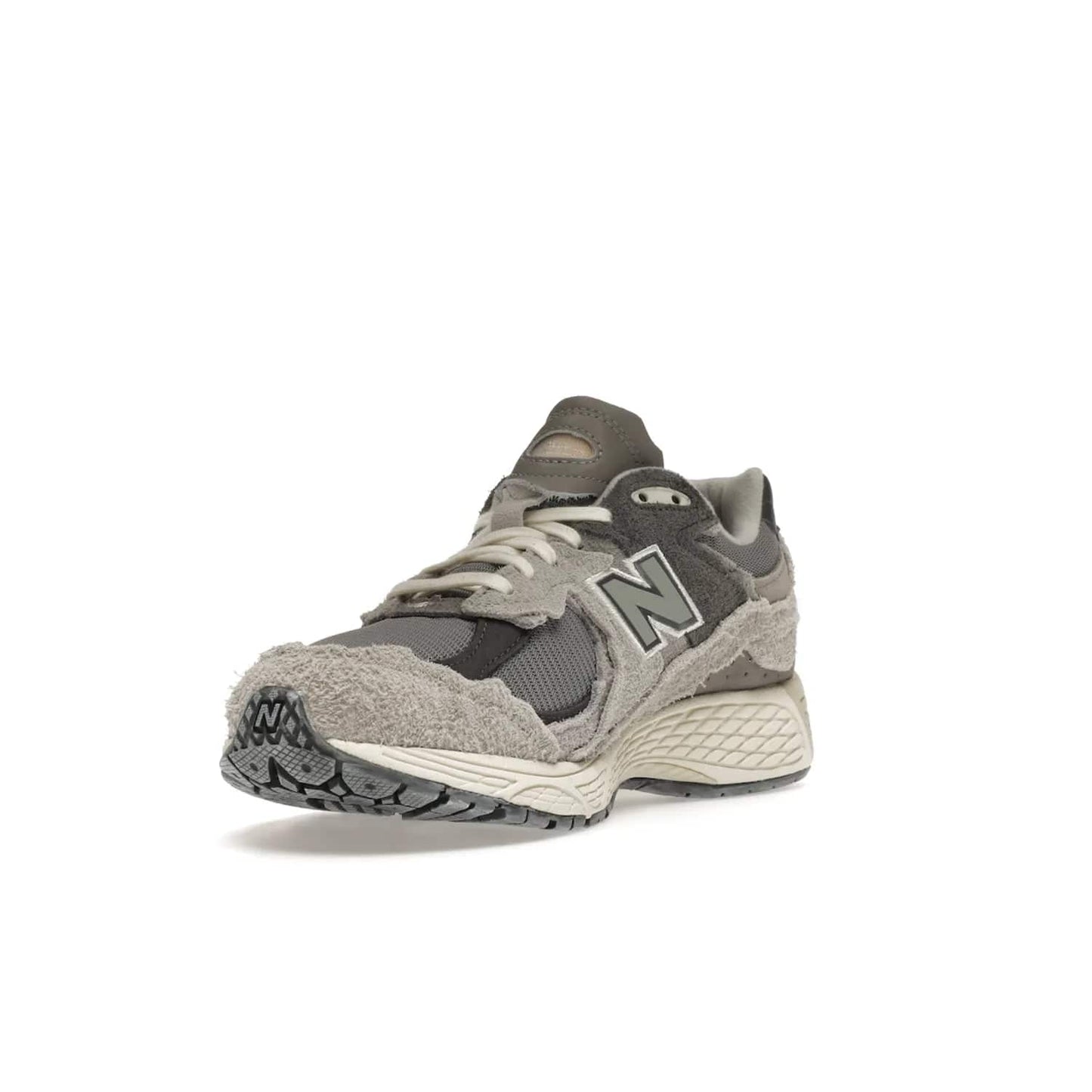 New Balance 2002R Protection Pack Rain Cloud - Image 14 - Only at www.BallersClubKickz.com - The New Balance 2002R Protection Pack Rain Cloud combines style and comfort. Featuring a grey mesh upper, jagged suede overlays and a reflective logo, a vibrant rain cloud motif on the heel stands out! Not just good-looking, the Nrgy midsole and soft grey outsole provide cushioning and comfort. Make a statement with the iconic New Balance 2002R Protection Pack Rain Cloud.