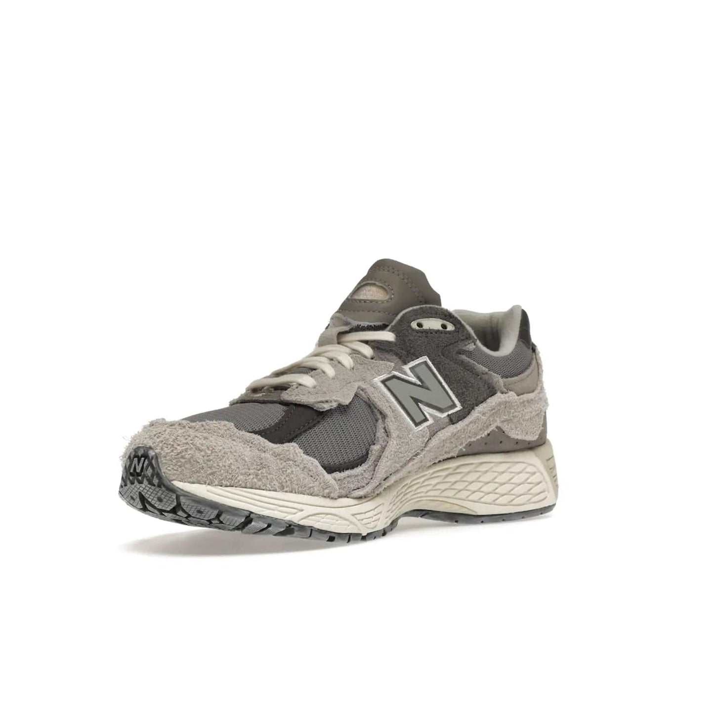 New Balance 2002R Protection Pack Rain Cloud - Image 15 - Only at www.BallersClubKickz.com - The New Balance 2002R Protection Pack Rain Cloud combines style and comfort. Featuring a grey mesh upper, jagged suede overlays and a reflective logo, a vibrant rain cloud motif on the heel stands out! Not just good-looking, the Nrgy midsole and soft grey outsole provide cushioning and comfort. Make a statement with the iconic New Balance 2002R Protection Pack Rain Cloud.