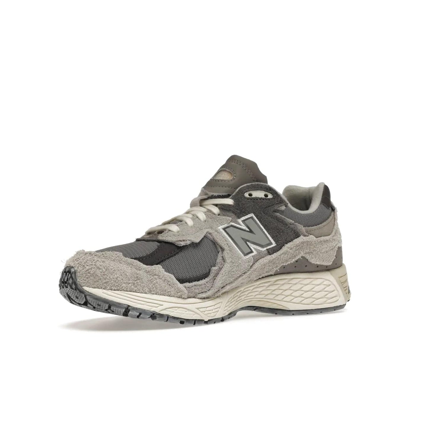 New Balance 2002R Protection Pack Rain Cloud - Image 16 - Only at www.BallersClubKickz.com - The New Balance 2002R Protection Pack Rain Cloud combines style and comfort. Featuring a grey mesh upper, jagged suede overlays and a reflective logo, a vibrant rain cloud motif on the heel stands out! Not just good-looking, the Nrgy midsole and soft grey outsole provide cushioning and comfort. Make a statement with the iconic New Balance 2002R Protection Pack Rain Cloud.