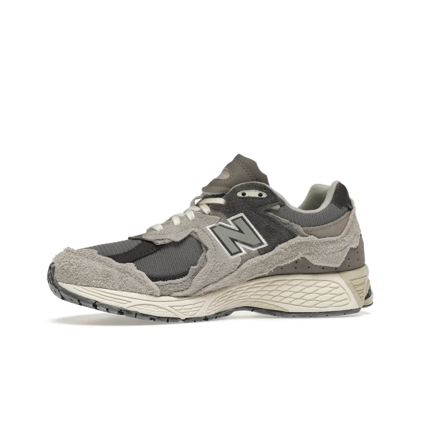 New Balance 2002R Protection Pack Rain Cloud - Image 18 - Only at www.BallersClubKickz.com - The New Balance 2002R Protection Pack Rain Cloud combines style and comfort. Featuring a grey mesh upper, jagged suede overlays and a reflective logo, a vibrant rain cloud motif on the heel stands out! Not just good-looking, the Nrgy midsole and soft grey outsole provide cushioning and comfort. Make a statement with the iconic New Balance 2002R Protection Pack Rain Cloud.