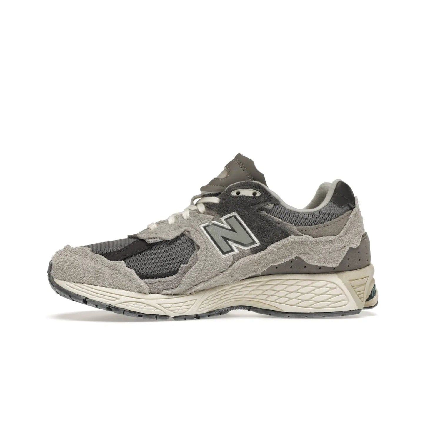 New Balance 2002R Protection Pack Rain Cloud - Image 19 - Only at www.BallersClubKickz.com - The New Balance 2002R Protection Pack Rain Cloud combines style and comfort. Featuring a grey mesh upper, jagged suede overlays and a reflective logo, a vibrant rain cloud motif on the heel stands out! Not just good-looking, the Nrgy midsole and soft grey outsole provide cushioning and comfort. Make a statement with the iconic New Balance 2002R Protection Pack Rain Cloud.