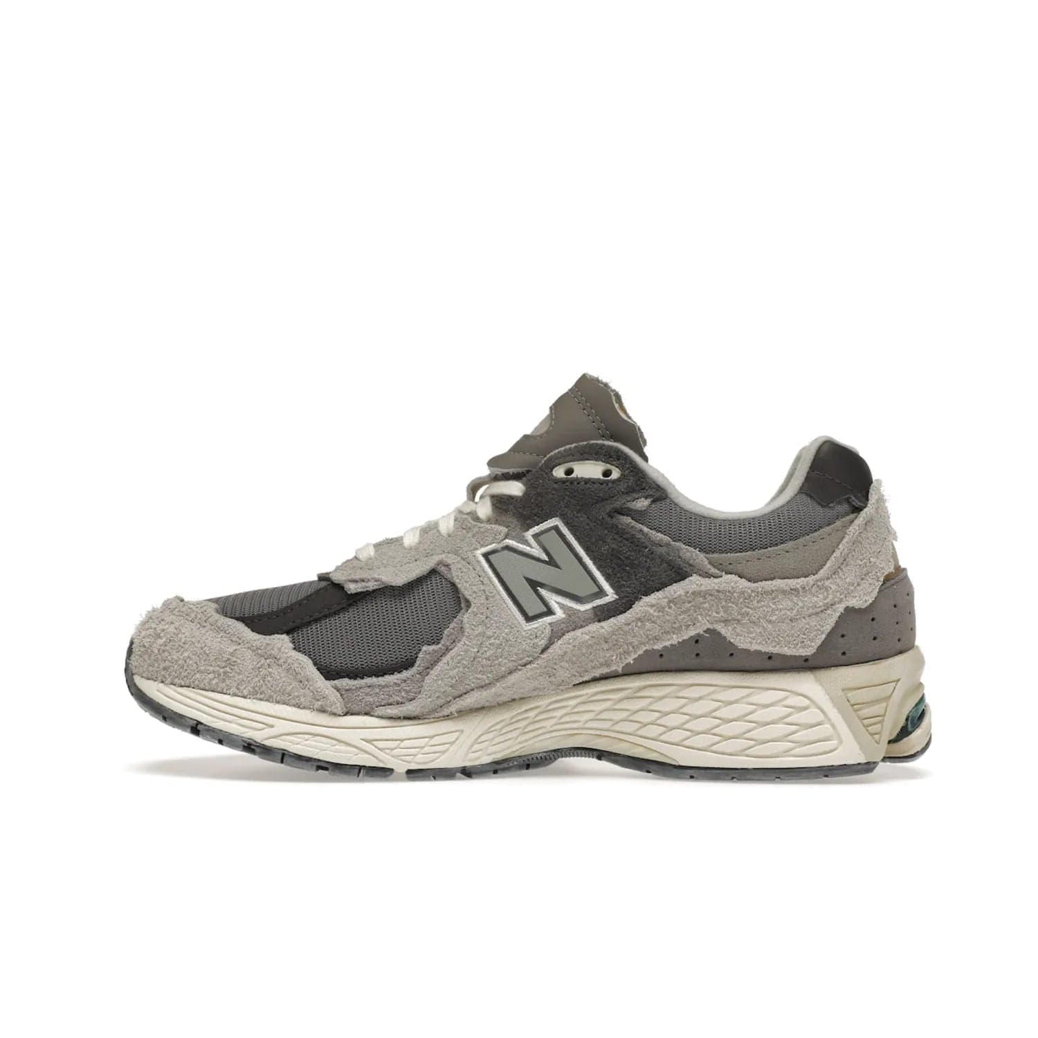 New Balance 2002R Protection Pack Rain Cloud - Image 20 - Only at www.BallersClubKickz.com - The New Balance 2002R Protection Pack Rain Cloud combines style and comfort. Featuring a grey mesh upper, jagged suede overlays and a reflective logo, a vibrant rain cloud motif on the heel stands out! Not just good-looking, the Nrgy midsole and soft grey outsole provide cushioning and comfort. Make a statement with the iconic New Balance 2002R Protection Pack Rain Cloud.