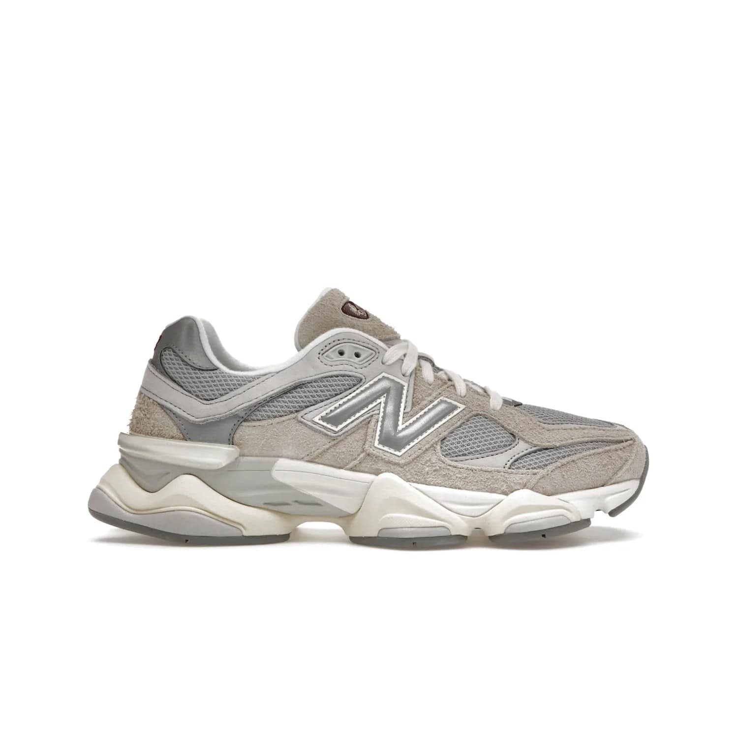New Balance 9060 Lunar New Year Timberwolf Grey - Image 1 - Only at www.BallersClubKickz.com - This New Balance 9060 Lunar New Year Timberwolf Grey features a mesh upper and furry suede overlays in a stylish Timberwolf/Rain Cloud/Silver Metallic colorway. Its contemporary design includes ABZORB and SBS cushioning, a chunky rubber sole, and a lace-up front. Crafted to offer nothing but the best in style and comfort, the shoe released on 2nd January 2023.