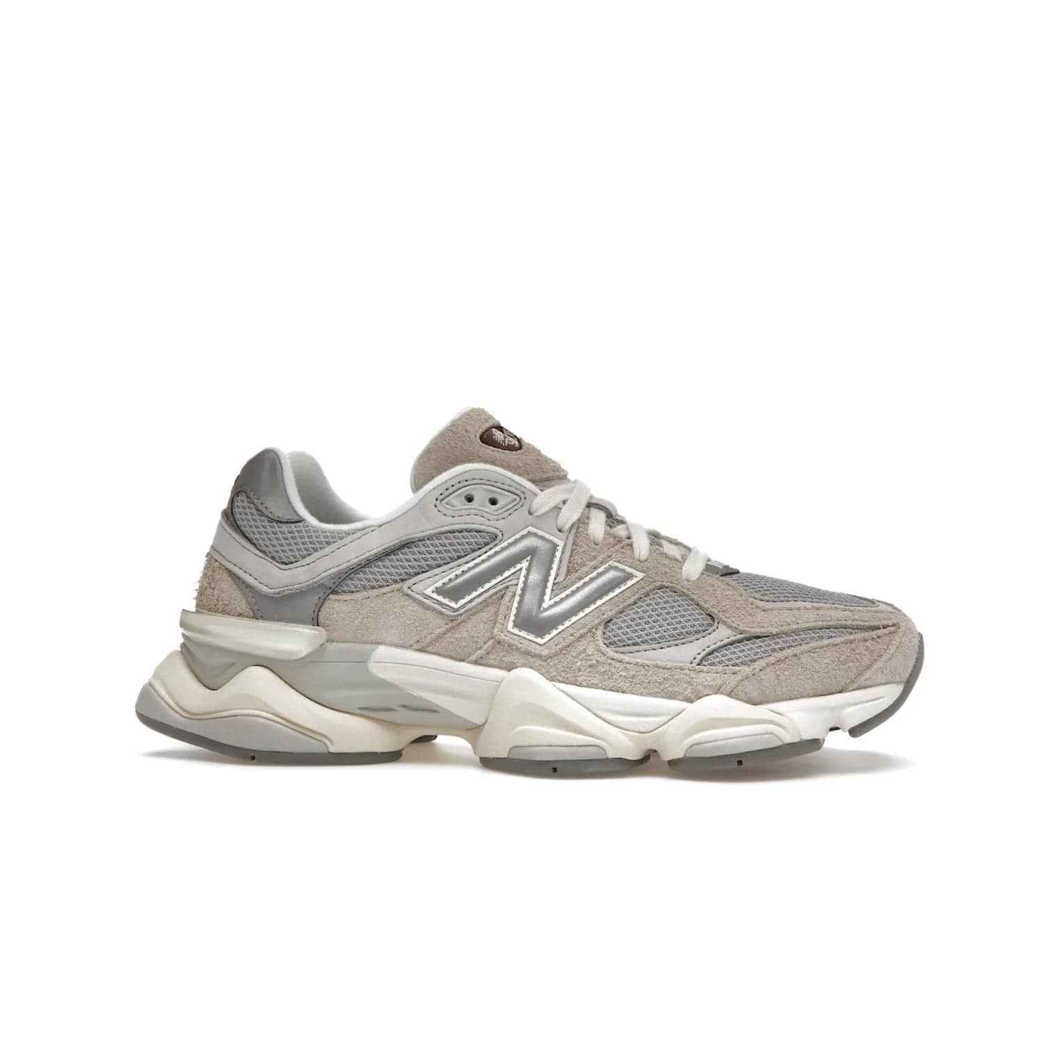 New Balance 9060 Lunar New Year Timberwolf Grey - Image 2 - Only at www.BallersClubKickz.com - This New Balance 9060 Lunar New Year Timberwolf Grey features a mesh upper and furry suede overlays in a stylish Timberwolf/Rain Cloud/Silver Metallic colorway. Its contemporary design includes ABZORB and SBS cushioning, a chunky rubber sole, and a lace-up front. Crafted to offer nothing but the best in style and comfort, the shoe released on 2nd January 2023.